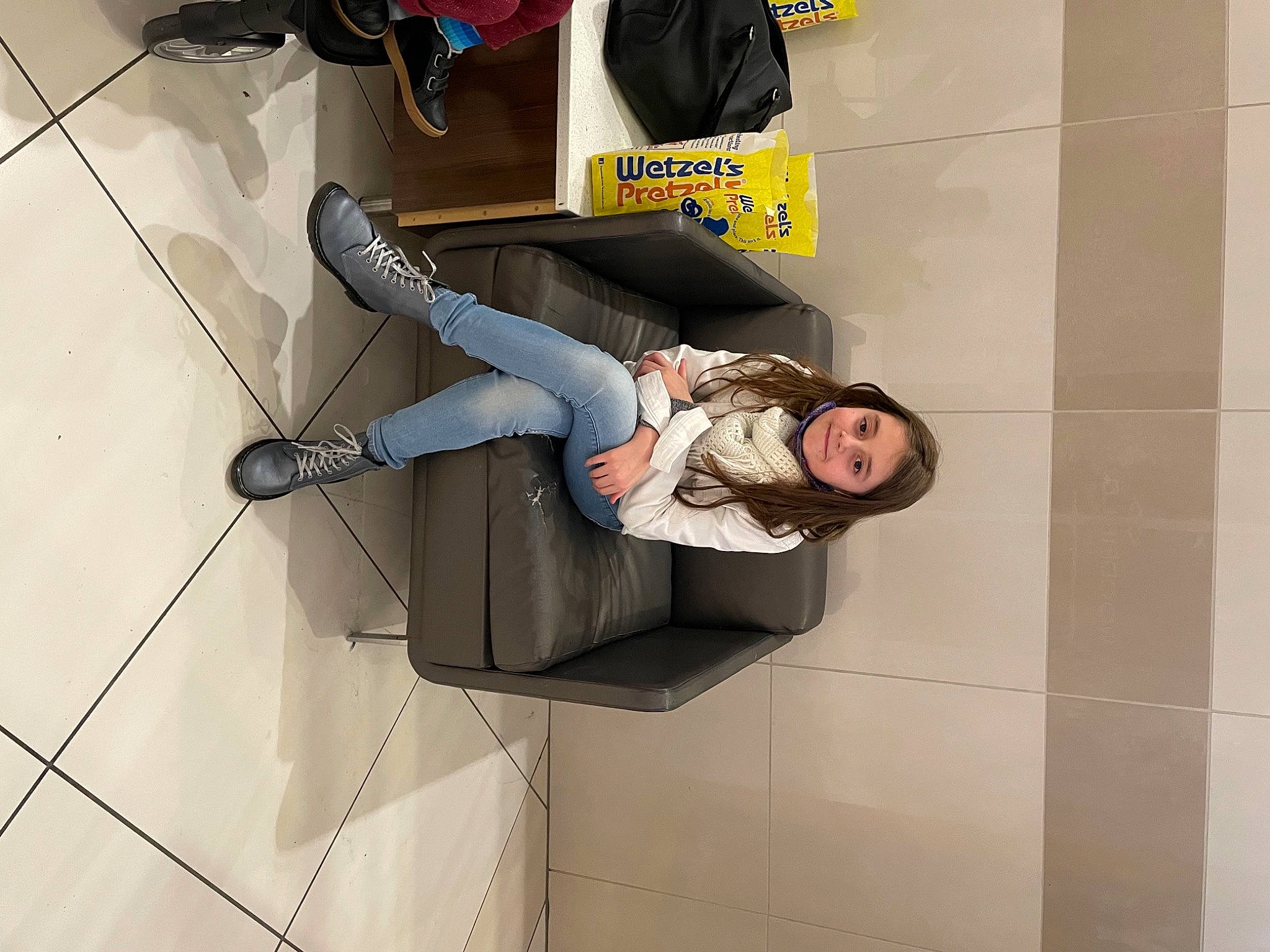 Maddie joined the competition — help win amazing prizes! automotive_design, backpack, bag, comfort, flooring, human_leg, jeans, joy, knee, leg, luggage_and_bags, outdoor_shoe, person, sandal, shoe, sitting, smile, sneakers, street_fashion, thigh