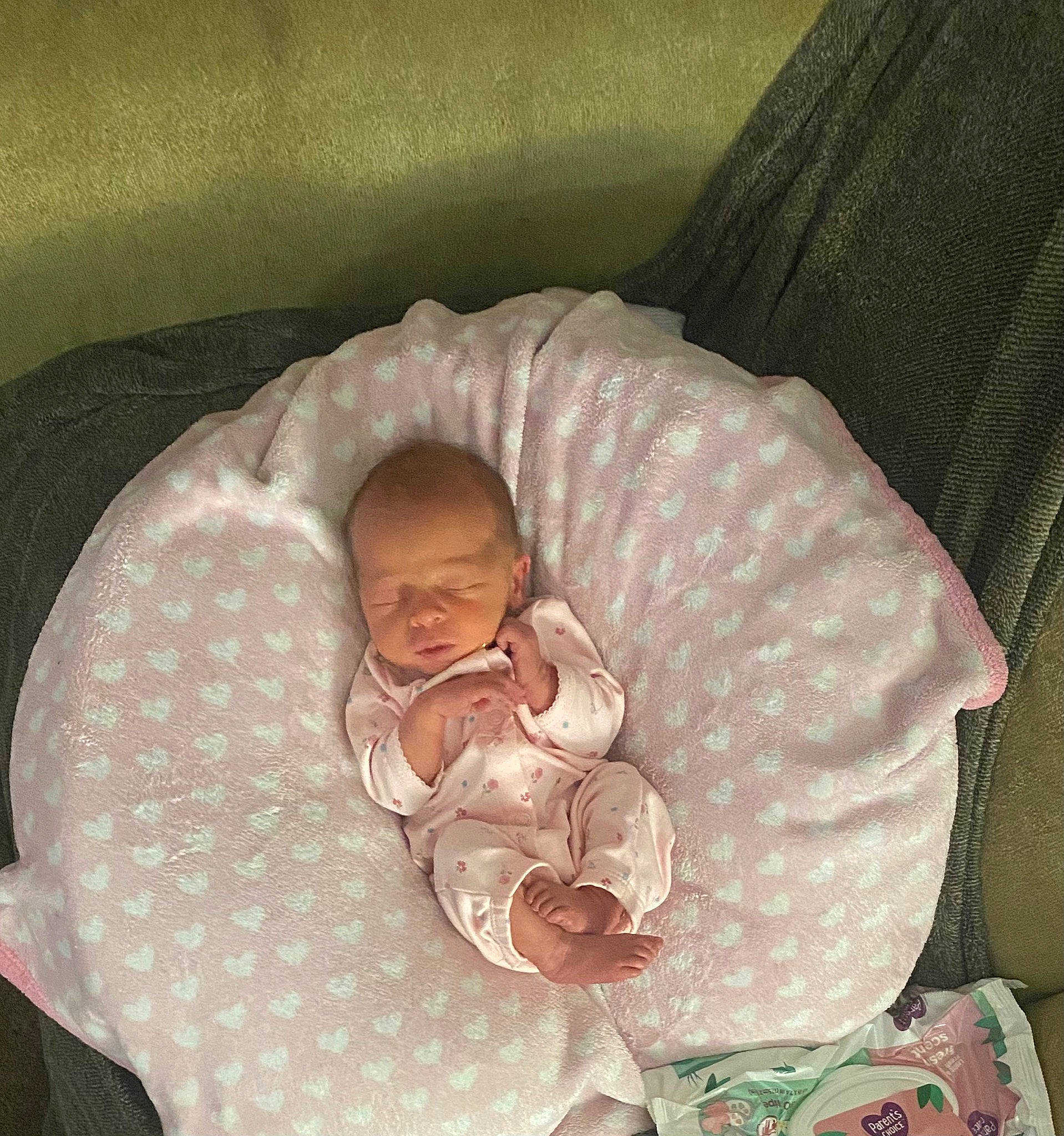 Saige is registered to the contest to win money with this photo: baby, baby_products, baby_safety, baby_sleeping, baby_toddler_clothing, baby_toys, bedtime, cheek, child, comfort, face, head, infant_bed, iris, linens, nap, person, room, sleeve, textile