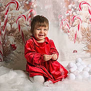 Esme is registered to the contest to win money with this photo: toddler, child, red_dress, smiling, snow, cotton, candy_cane, christmas, holiday, decorations, festive, white, background, happy, portrait, indoor, cute, winter, celebration, seasonal