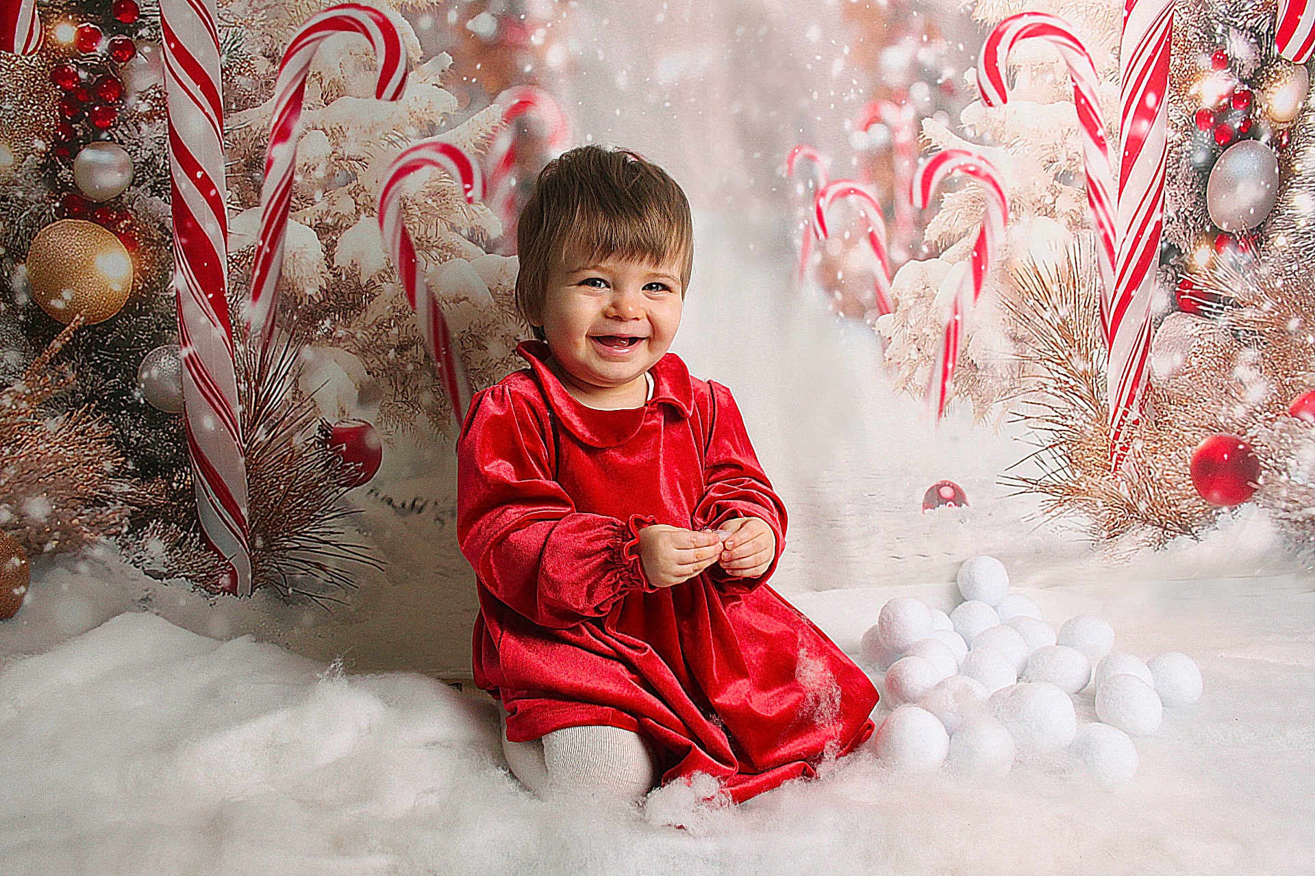 Esme is registered to the contest to win money with this photo: toddler, child, red_dress, smiling, snow, cotton, candy_cane, christmas, holiday, decorations, festive, white, background, happy, portrait, indoor, cute, winter, celebration, seasonal