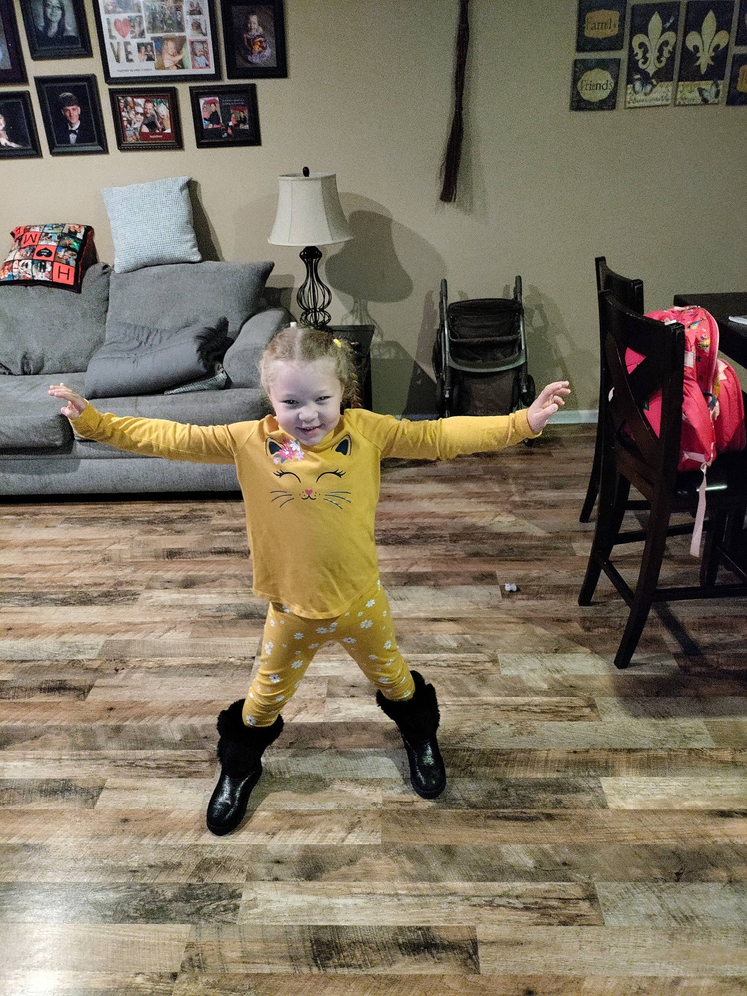 Jazmyn joined the competition — help win amazing prizes! art, balance, couch, event, fashion_design, fictional_character, floor, flooring, fun, fur, happy, hardwood, joy, lamp, performing_arts, person, picture_frame, room, suit, toddler