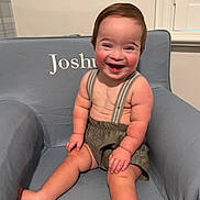 Joshua joined the competition — help win amazing prizes! toddler, child, smiling, happy, sitting, armchair, clothing, suspenders, shorts, face, person, indoor, furniture, baby, cute, rosy_cheeks, hair, window, home, portrait