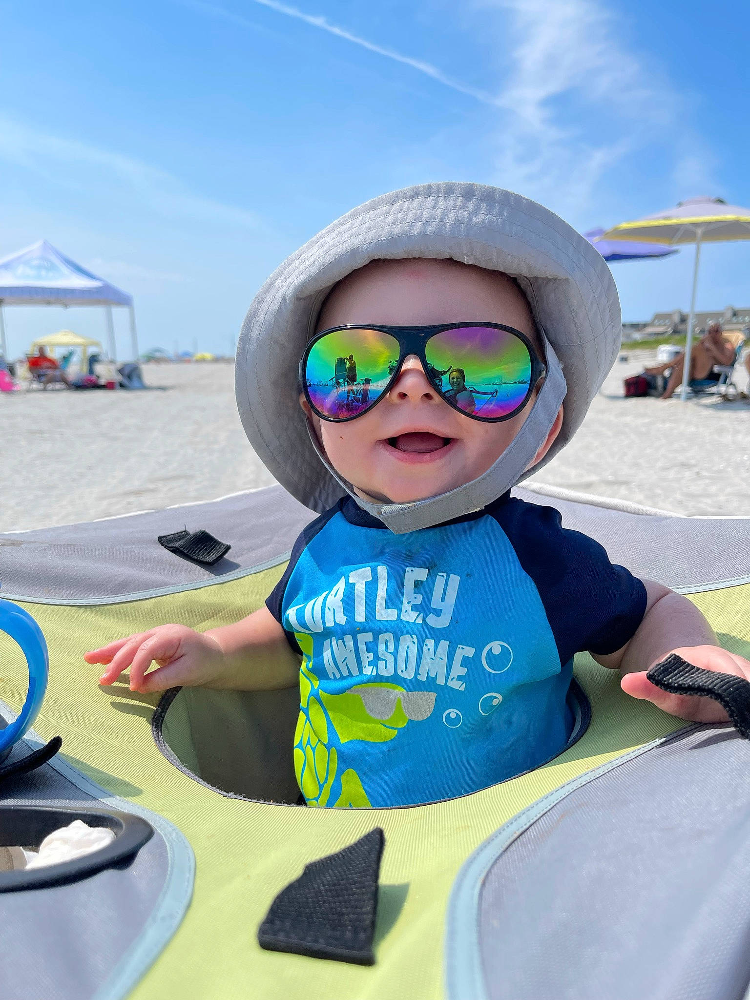 Colton is registered to the contest to win money with this photo: baseball_cap, cap, child, cloud, cool, eyewear, fun, glasses, goggles, happy, hat, leisure, person, personal_protective_equipment, recreation, sky, smile, sunglasses, toddler, travel