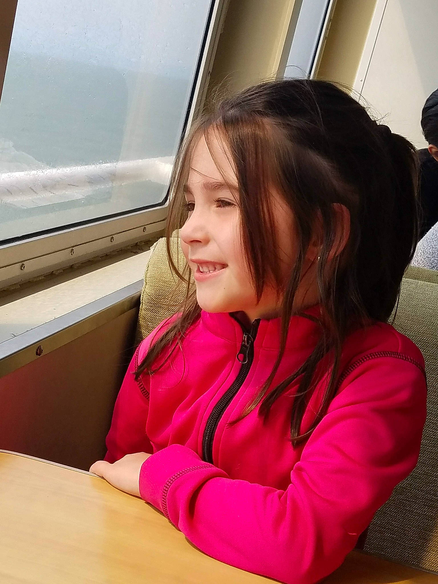 Caylee joined the competition — help win amazing prizes! air_travel, airline, auto_part, child, fun, hairstyle, happy, leisure, long_hair, magenta, passenger, person, room, sitting, skin, smile, table, toddler, travel, vacation