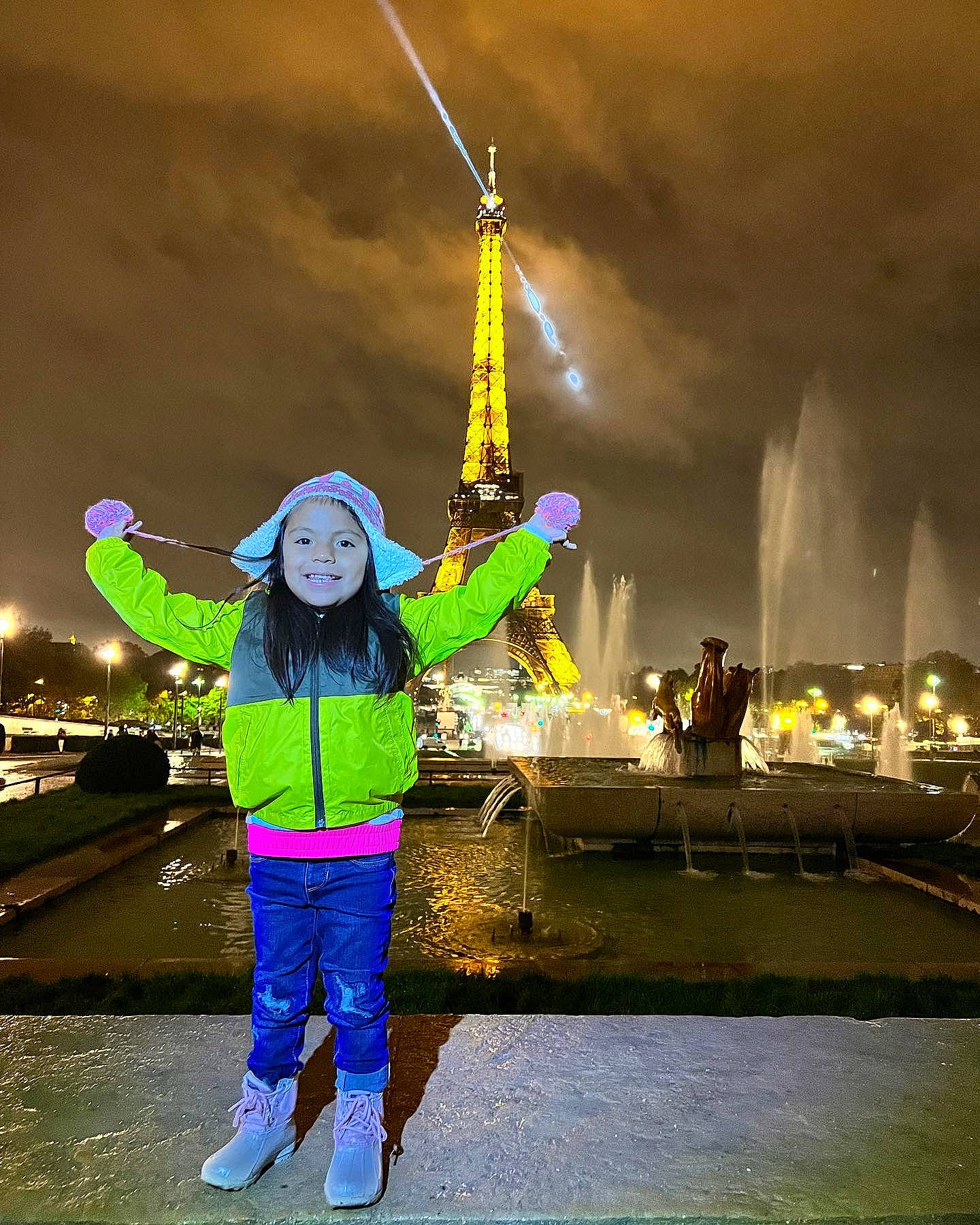 Kendra is registered to the contest to win money with this photo: city, cloud, darkness, electric_blue, electricity, event, flag, flash_photography, fun, gesture, happy, joy, leisure, midnight, night, people_in_nature, person, sky, spire, symmetry