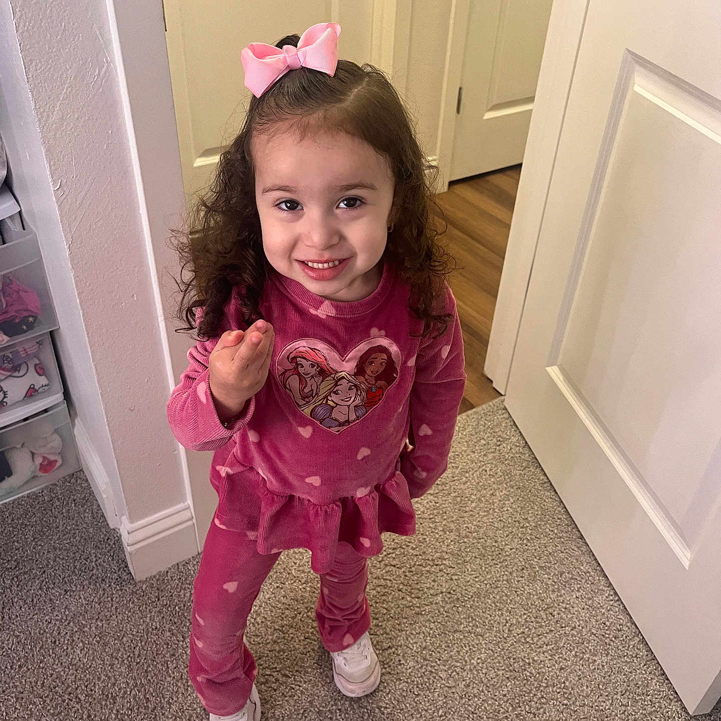 Ximema is registered to the contest to win money with this photo: bodypart, child, clothing, costume, door, dress, face, female, finger, footwear, girl, hand, hardwood, head, pajamas, person, photography, portrait, shoe, wood