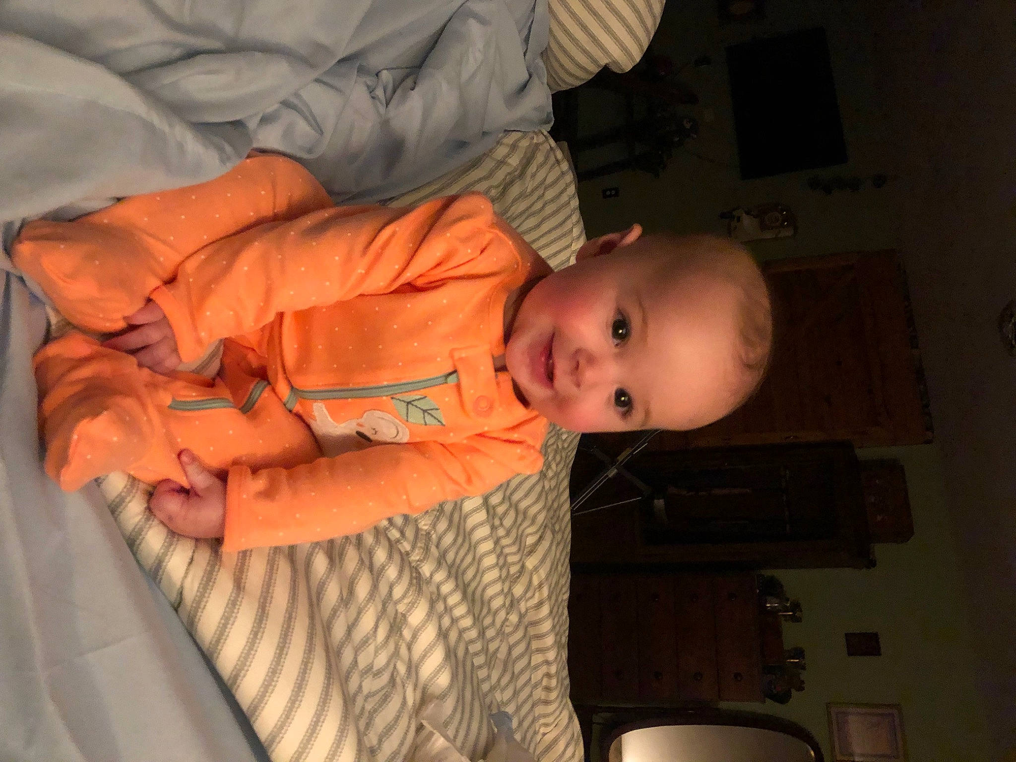 Sunni joined the competition — help win amazing prizes! baby, baby_products, baby_toddler_clothing, cheek, child, comfort, finger, fun, human_body, mouth, person, room, sitting, sleeve, smile, toddler