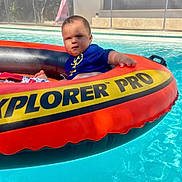Lorenz participe au concours pour gagner de l'argent avec cette photo : baby, blue, child, cute, float, inflatable_ring, leisure, orange, outdoor, person, pool, recreation, relaxation, summer, sunlight, swimming, vacation, water, water_sport, yellow
