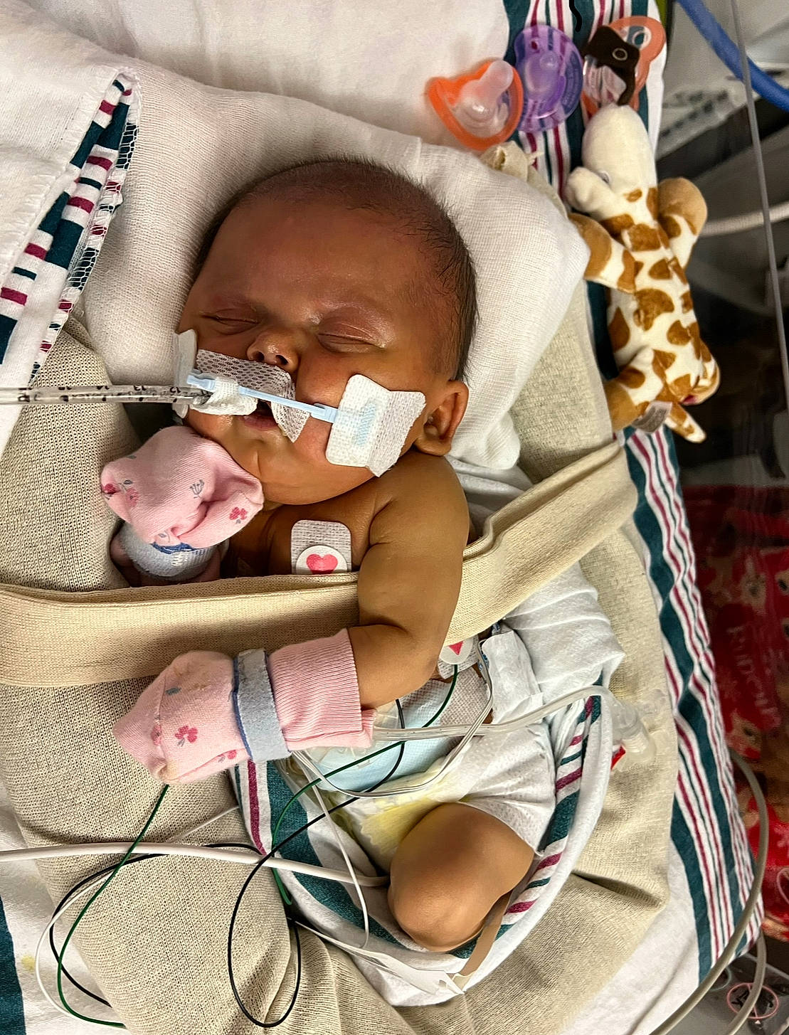 Miracle joined the competition — help win amazing prizes! baby, baby_carriage, baby_products, baby_safety, baby_sleeping, baby_toddler_clothing, car_seat, cheek, child, comfort, eyelash, eyewear, infant_bed, linens, mouth, person, product, room, sitting, skin