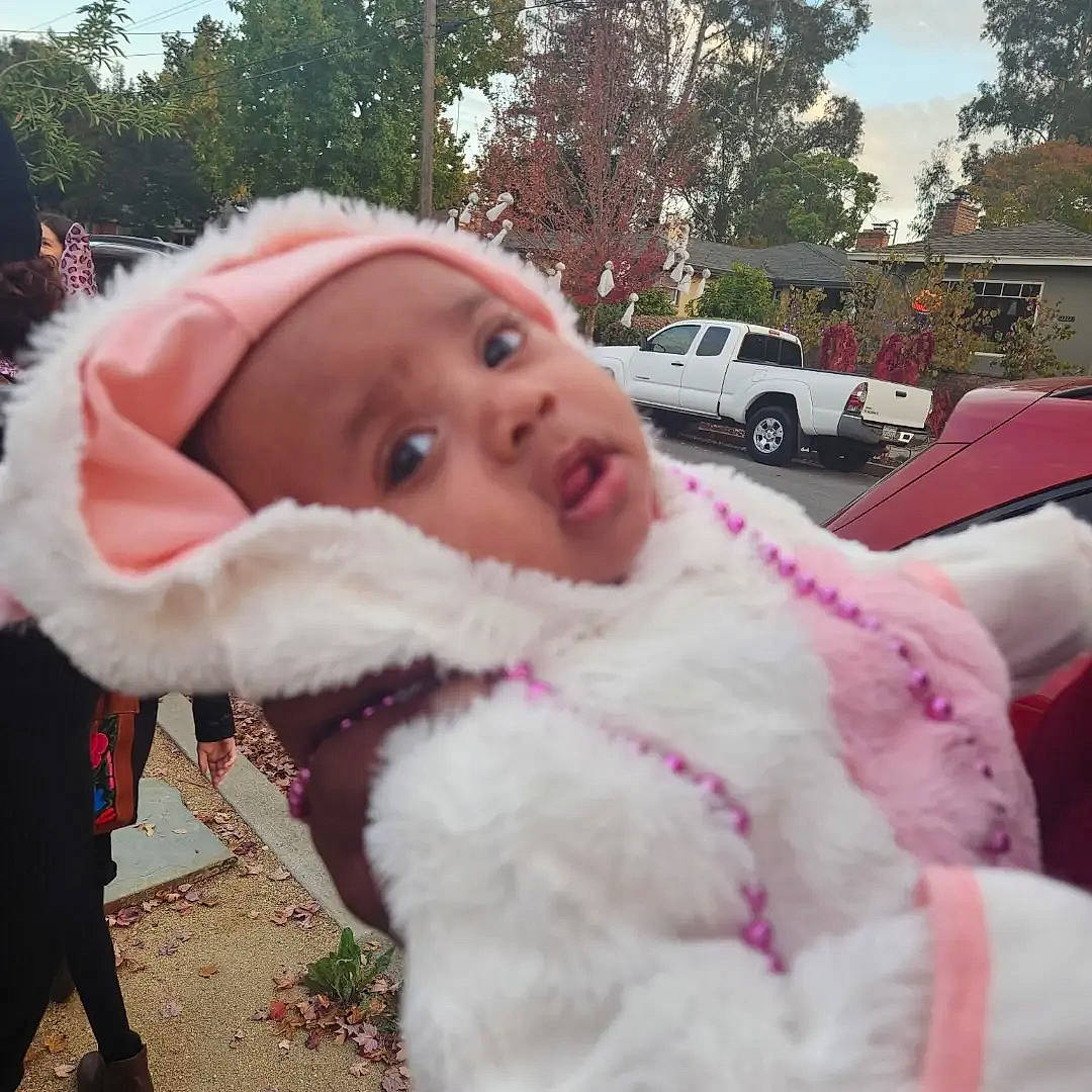 Aliza joined the competition — help win amazing prizes! baby, car, child, event, family_car, freezing, fun, fur, fur_clothing, grass, happy, luxury_vehicle, magenta, person, pink, plant, toddler, toy, tree, vehicle_door