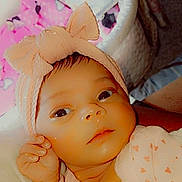 Jasmine joined the competition — help win amazing prizes! baby, infant, headband, bow, pink, face, eyes, hand, clothing, heart_pattern, blanket, soft, cute, portrait, closeup, child, newborn, skin, expression, indoors