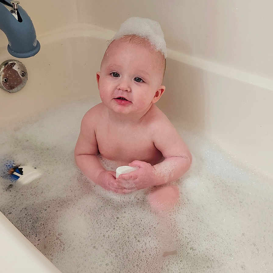 Braxton joined the competition — help win amazing prizes! baby, back, bathing, bathtub, bodypart, face, finger, hand, head, indoors, newborn, person, photography, portrait, tap, tub