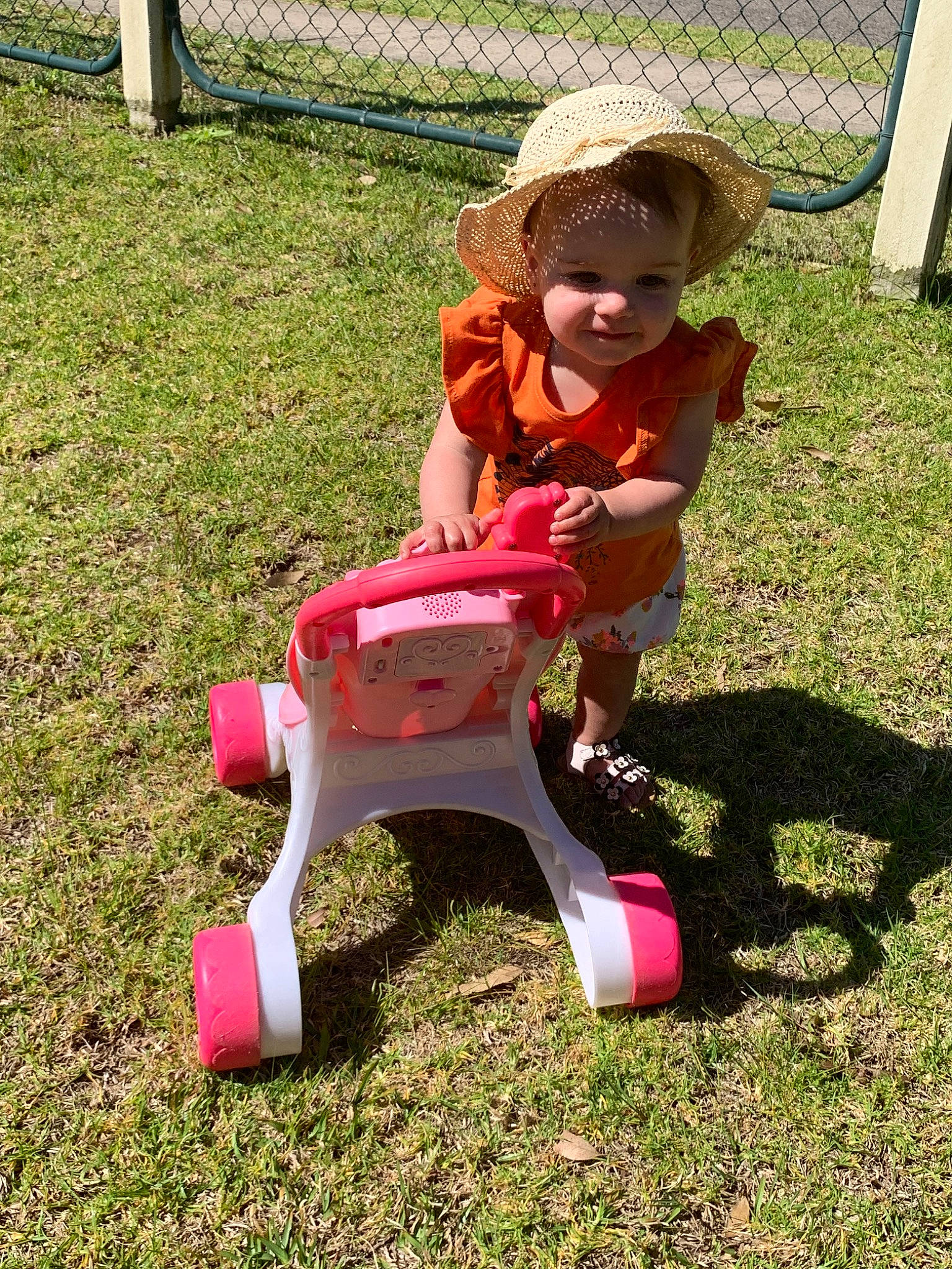 Kyrah is registered to the contest to win money with this photo: child, fun, grass, lawn, person, pink, plant, play, riding_toy, summer, toddler, toy, tricycle, vehicle
