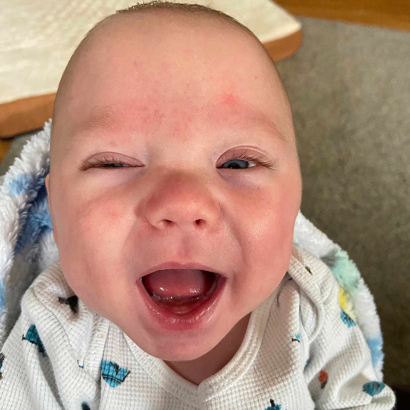 Jaxson is registered to the contest to win money with this photo: baby, babylaughing, clothing, face, happy, head, knitwear, laughing, person, photography, portrait, sweater, yawning