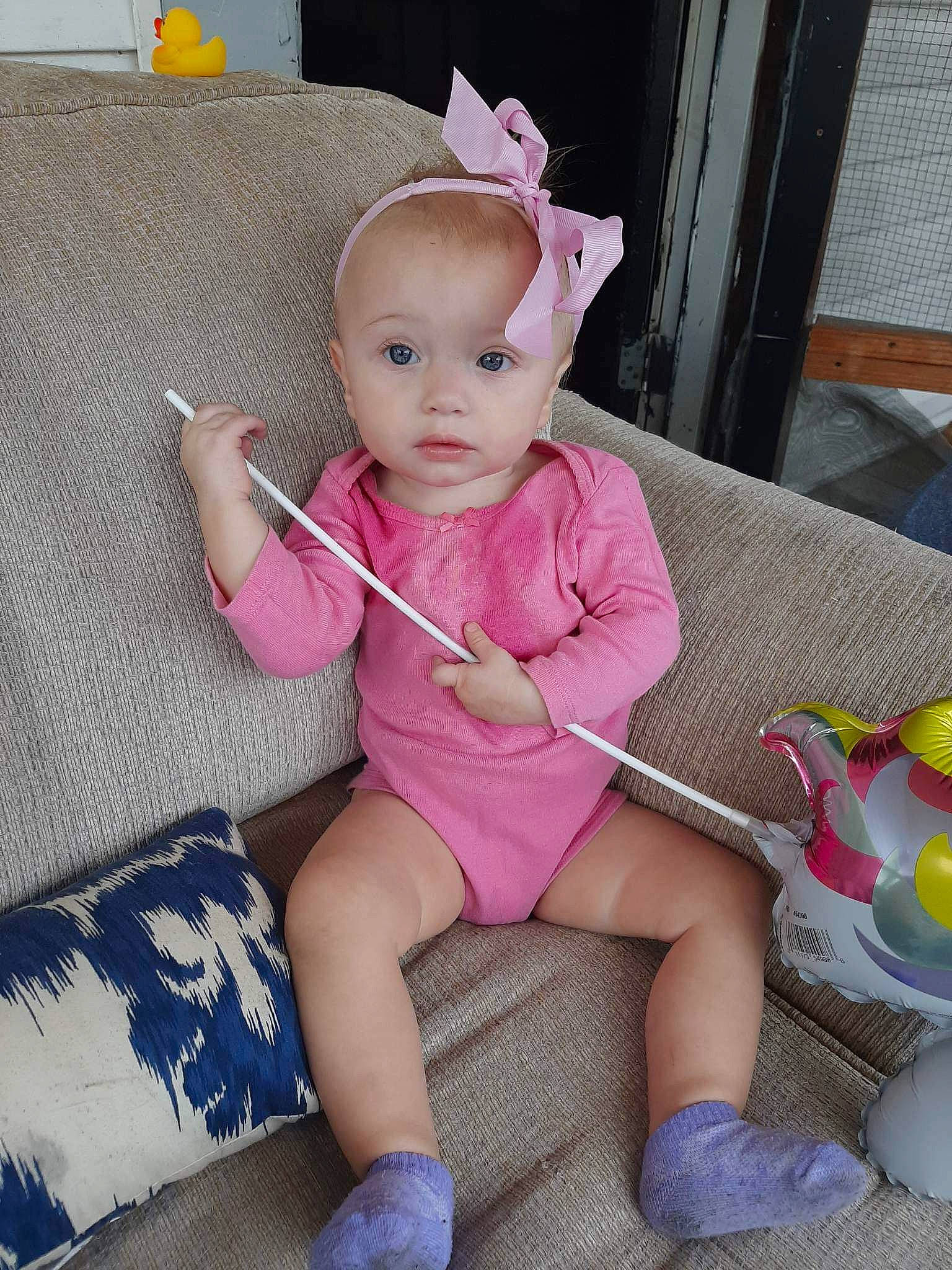 Skylar joined the competition — help win amazing prizes! baby, baby_products, baby_toddler_clothing, child, fashion_accessory, foot, human_leg, knee, lap, leg, magenta, pattern, person, pink, sitting, sleeve, sock, textile, thigh, toddler