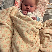 Violet joined the competition — help win amazing prizes! baby, infant, blanket, baby_seat, bouncer, face, eyes, hand, onesie, pattern, smile, cozy, nursery, toy_monkey, rainbow, elephant, pillow, fabric, home_interior, portrait