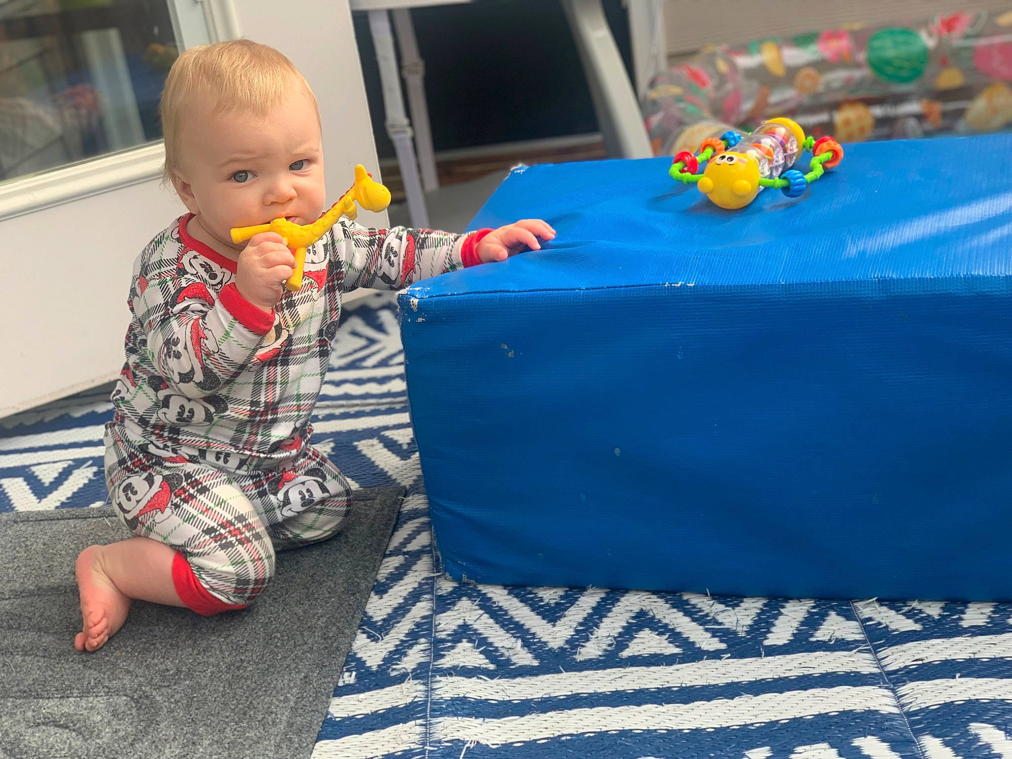 Kayce is registered to the contest to win money with this photo: baby, baby_toddler_clothing, baby_toys, baked_goods, chair, child, electric_blue, event, flooring, fun, leisure, linens, pattern, person, picture_frame, play, recreation, room, sitting, t_shirt