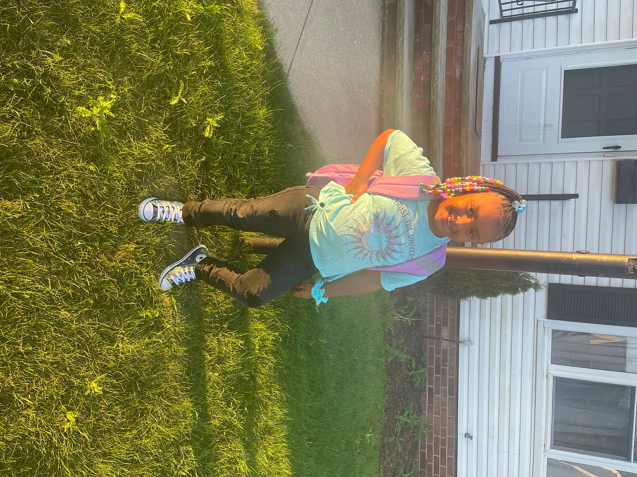 Demi is registered to the contest to win money with this photo: door, fun, garden, grass, happy, houseplant, joy, leisure, people_in_nature, person, plant, porch, pumpkin, recreation, shadow, shorts, shrub, tree, window, yard