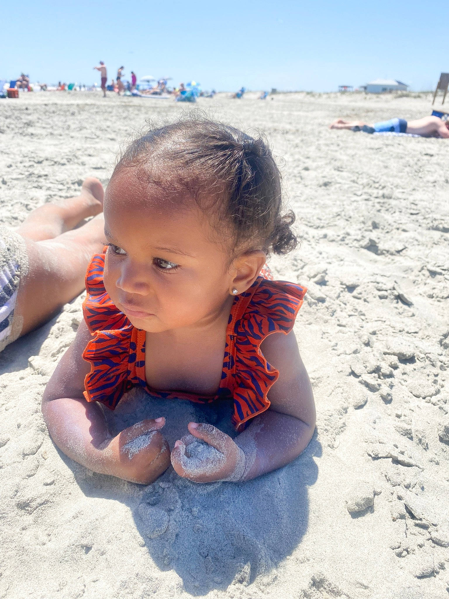 Ava joined the competition — help win amazing prizes! baby, beach, body_of_water, child, coast, foot, fun, happy, holiday, leisure, ocean, people_in_nature, people_on_beach, person, sand, sitting, sky, toddler, travel, vacation