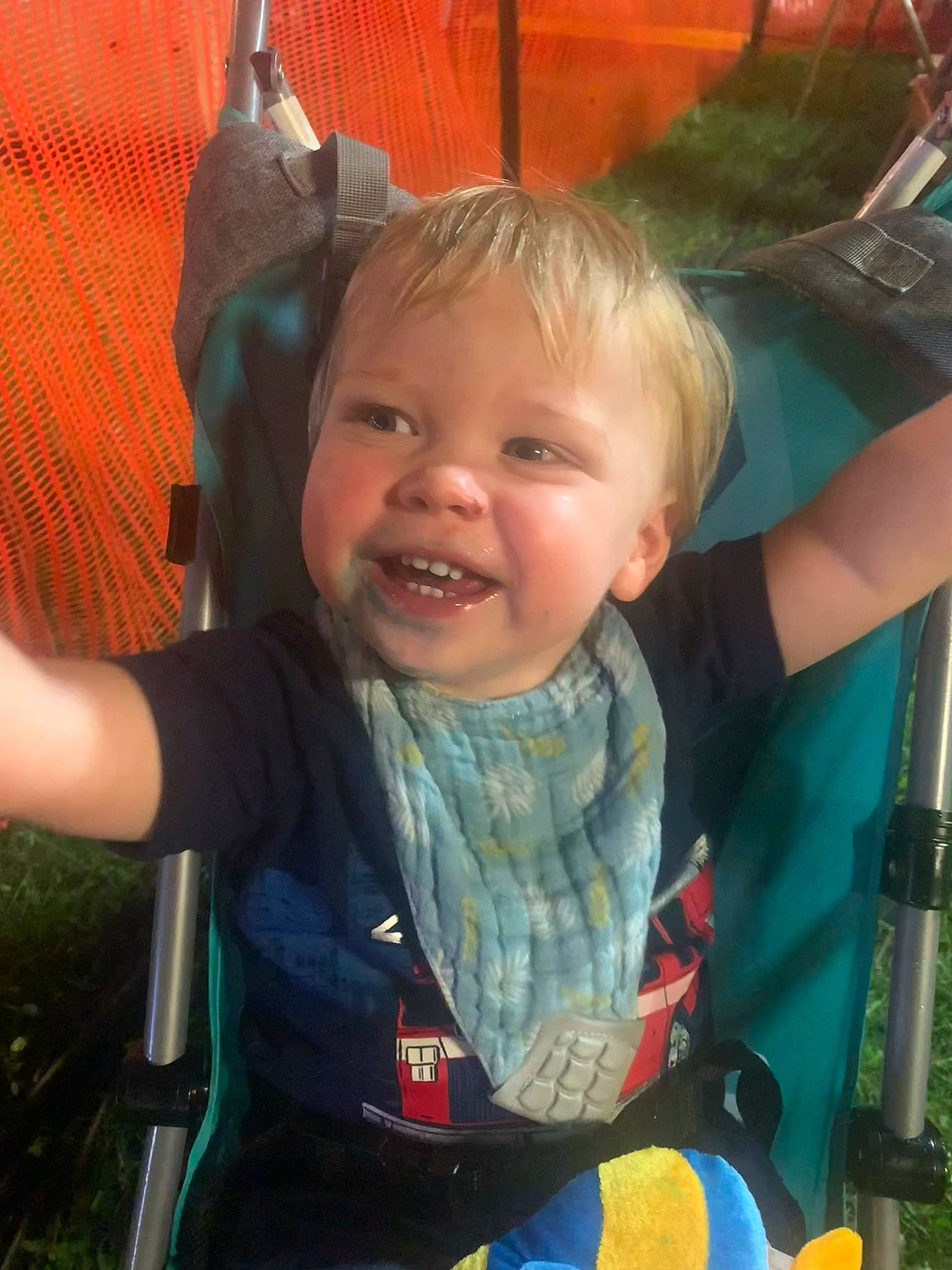 Matthew is registered to the contest to win money with this photo: baby_carriage, child, eye, facial_expression, finger, fun, gesture, grass, hairstyle, happy, human_body, iris, leisure, mouth, organ, people, person, seat_belt, skin, smile