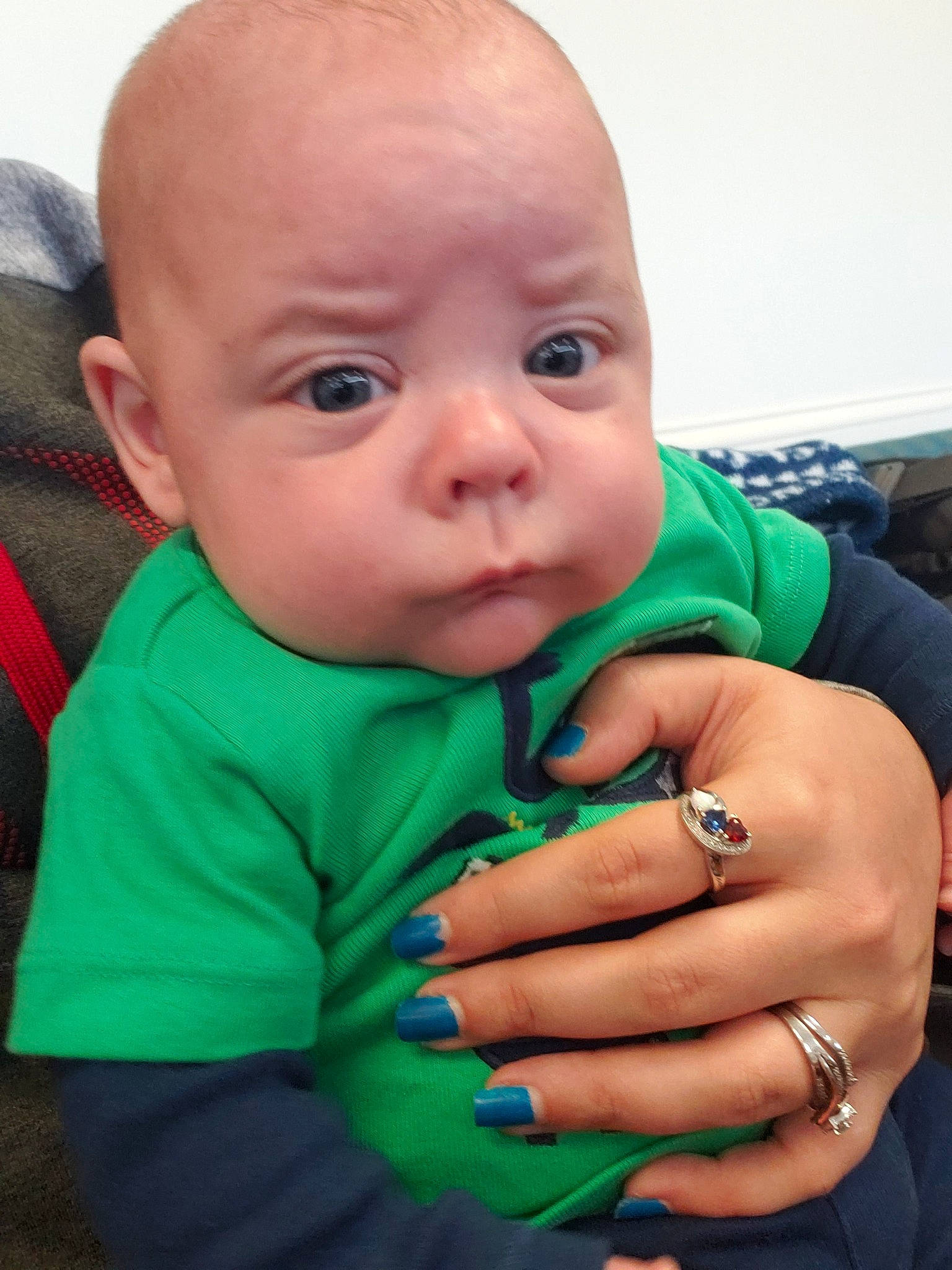 Dillon joined the competition — help win amazing prizes! baby, cheek, child, chin, ear, eye, face, finger, gesture, green, hand, head, lip, mouth, nail, nose, person, skin, smile, thumb