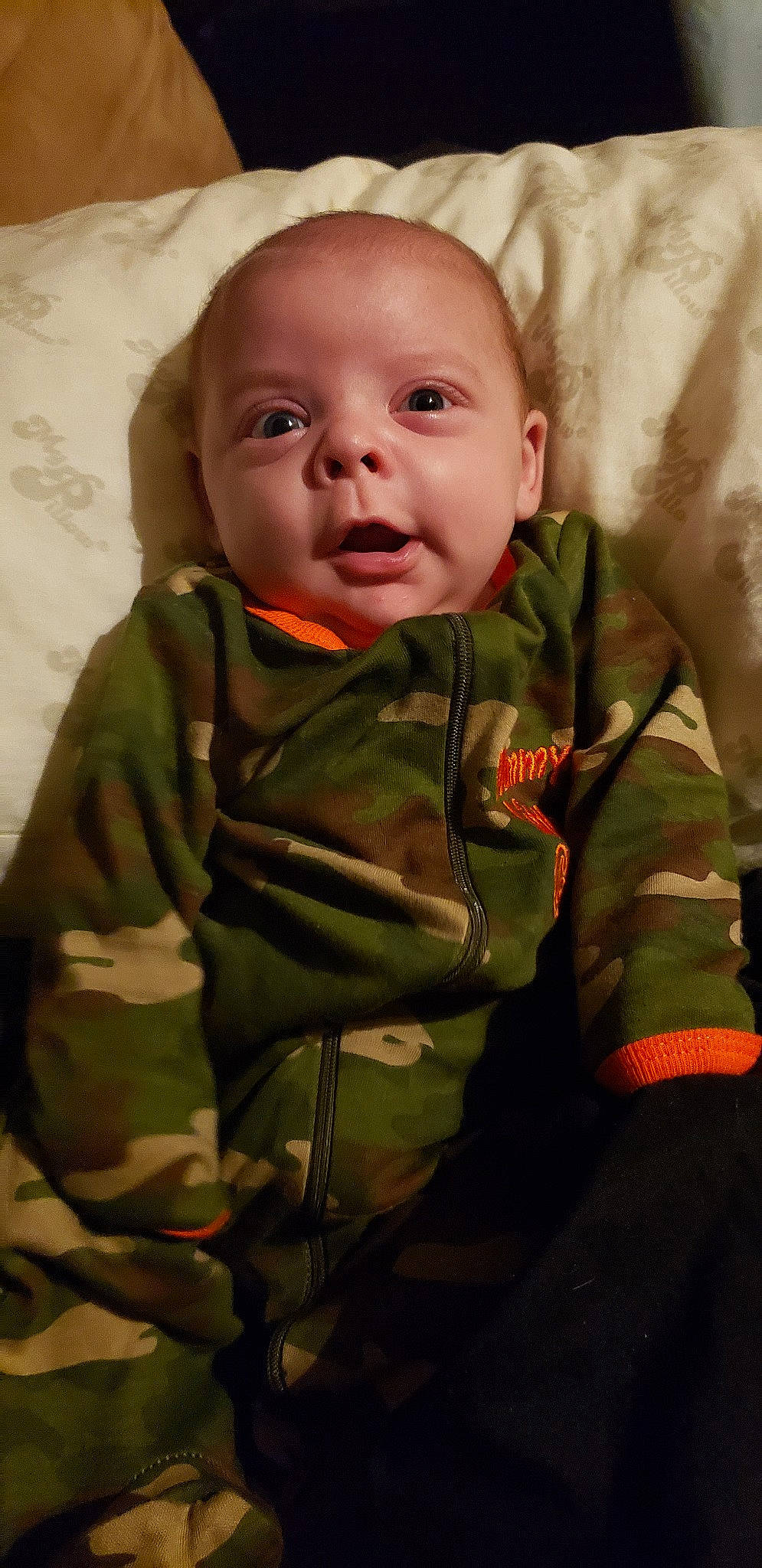 Dillon is registered to the contest to win money with this photo: baby, cheek, child, eye, face, head, mouth, nose, person, skin, sleeve, smile, soldier, toddler