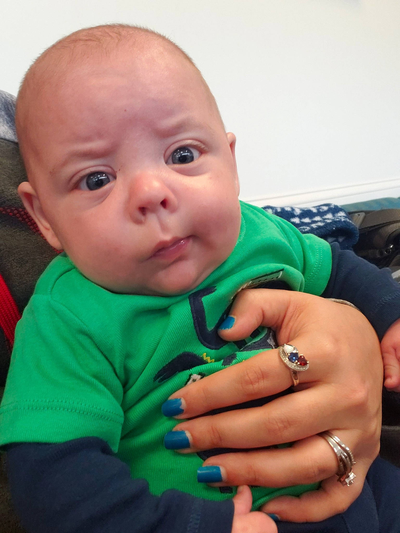 Dillon is registered to the contest to win money with this photo: arm, baby, cheek, child, eye, face, finger, gesture, hand, head, lip, mouth, nail, nose, person, skin, smile, thumb, toddler