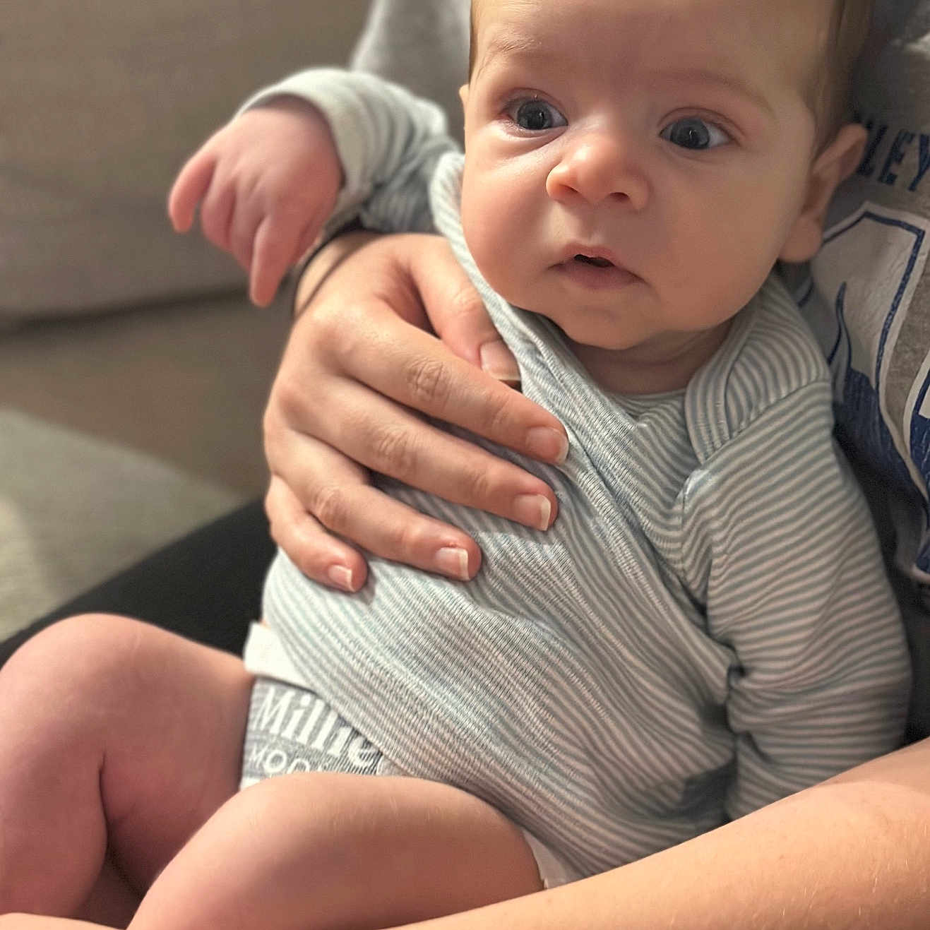 Jorah joined the competition — help win amazing prizes! baby, bodypart, clothing, couch, face, finger, furniture, hand, happy, head, hugging, newborn, pants, people, person, photography, portrait, sitting, smile, t_shirt