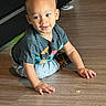 toddler, child, crawling, indoor, floor, wooden_floor, tshirt, pants, baby, person, small_child, cute, playful, curious, young_child, casual_clothing, human, head, hands, smiling