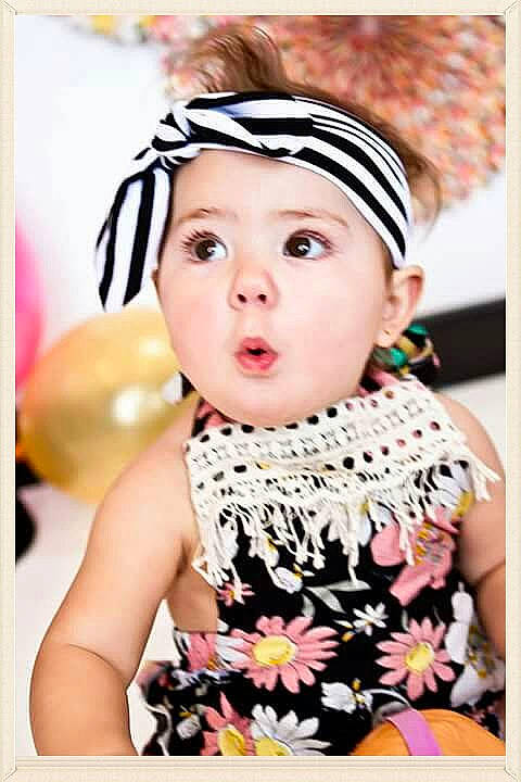 Macie joined the competition — help win amazing prizes! child, child_model, fashion_accessory, girl, hair_accessory, headband, headgear, headpiece, headwear, pattern, person, surprise, toddler