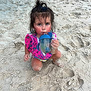 Violetta joined the competition — help win amazing prizes! child, toddler, beach, sand, sippy_cup, floatation_vest, messy_hair, pony_tail, sitting, drinking, outdoor, play, summer, water_toy, footprints, curious, cute, sun_kissed, vacation, fun