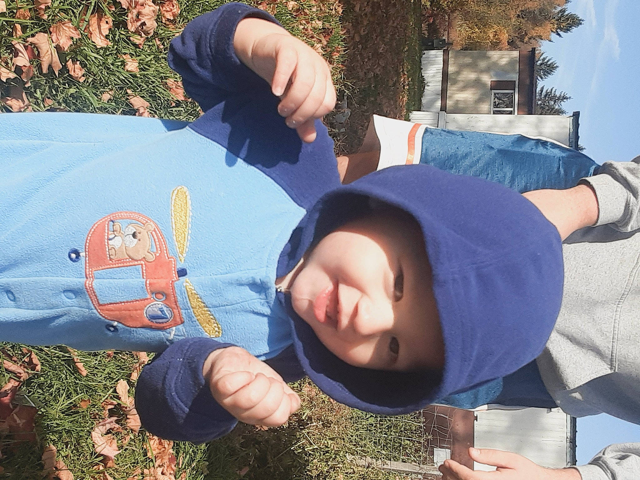 Nikolai is registered to the contest to win money with this photo: arm, child, eyewear, fun, grass, grassland, hand, happy, headwear, leisure, people_in_nature, person, plant, play, recreation, sitting, sky, soil, t_shirt, toddler