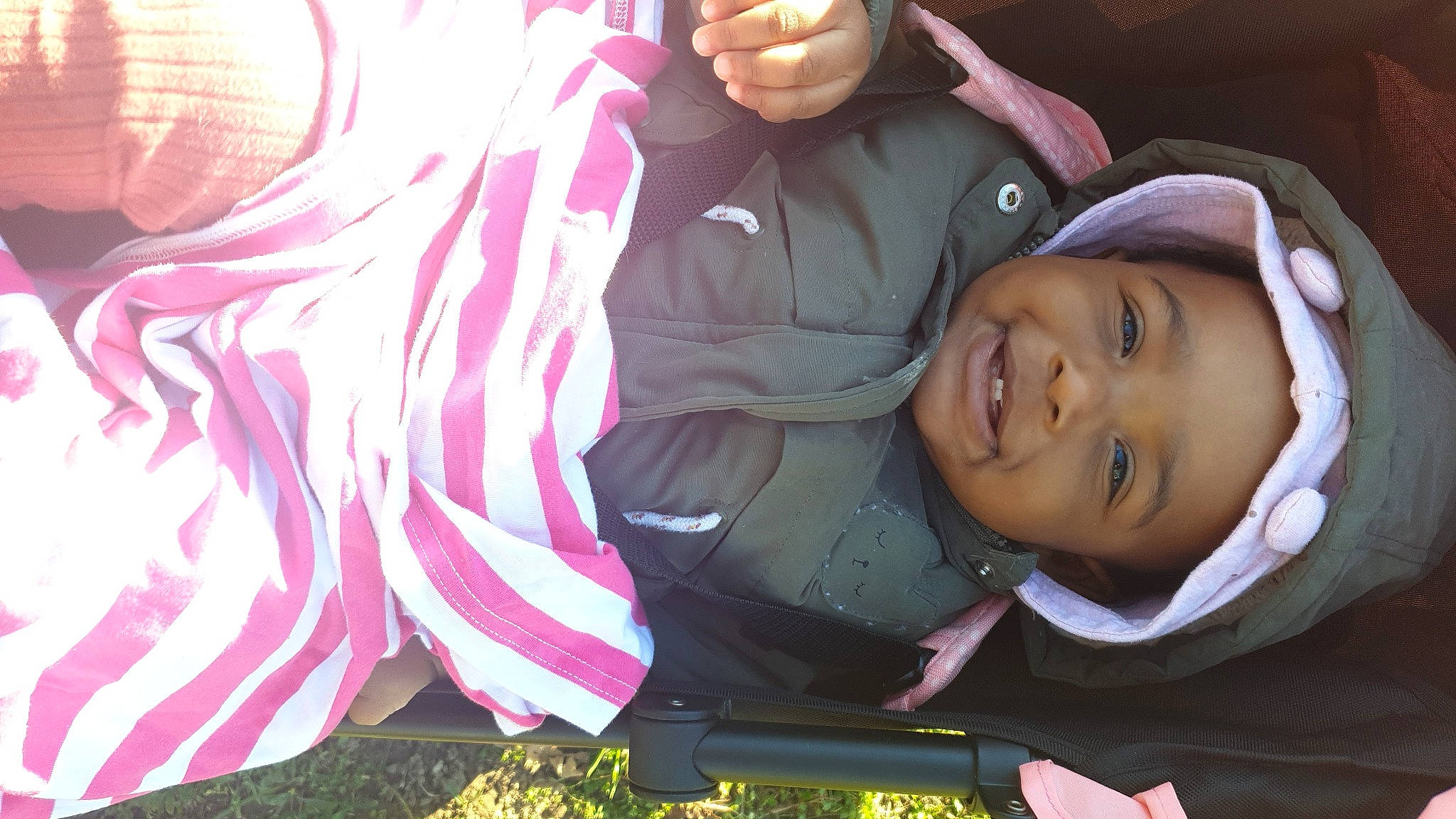 Ynociane participe au concours pour gagner de l'argent avec cette photo : art, baby, cool, facial_expression, fun, grass, happy, headgear, headwear, jacket, leisure, magenta, mouth, person, photograph, pink, plant, smile, snapshot, toddler