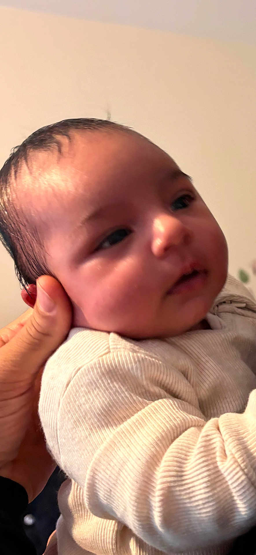 Aaniya is registered to the contest to win money with this photo: baby, infant, hand, skin, face, clothing, person, closeup, human, cute, newborn, portrait, young, child, soft, warm, indoor, expression, toddler, holding