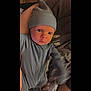 Kyden is registered to the contest to win money with this photo: baby, beanie, bonnet, cap, clothing, couch, doll, face, furniture, hat, head, hood, hoodie, knitwear, newborn, person, photography, portrait, toy, undershirt