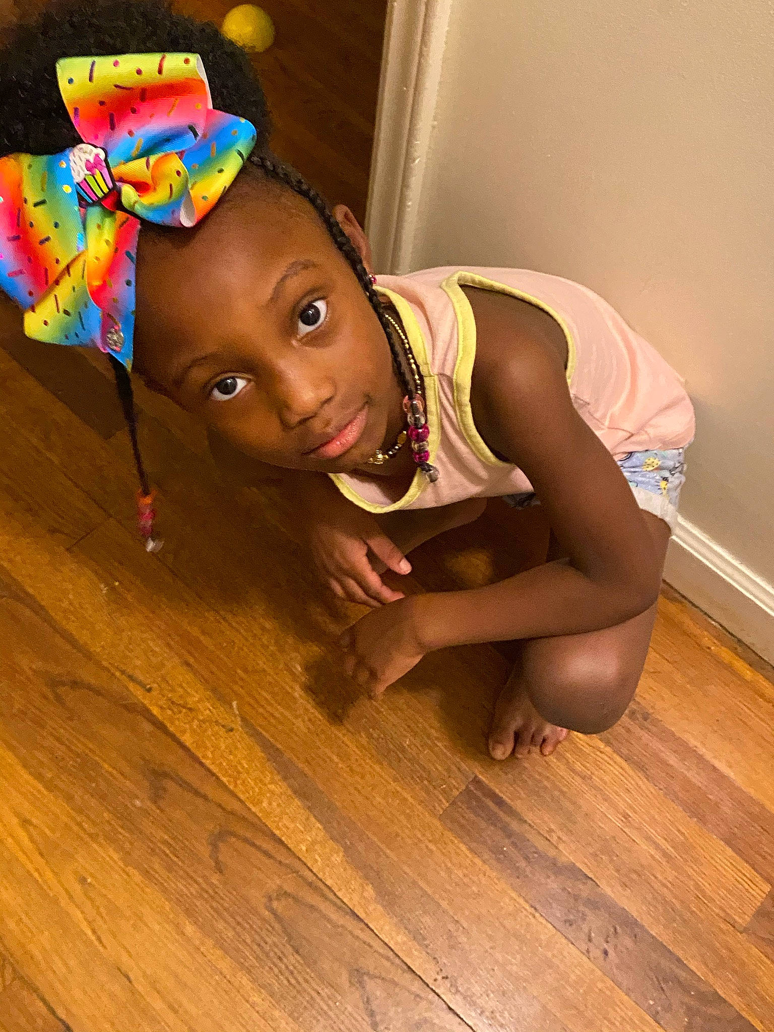 Ivoree is registered to the contest to win money with this photo: barefoot, elbow, eye, floor, flooring, foot, happy, hardwood, human_leg, knee, laminate_flooring, person, plank, thigh, toddler, toy, trunk, varnish, wood, wood_flooring