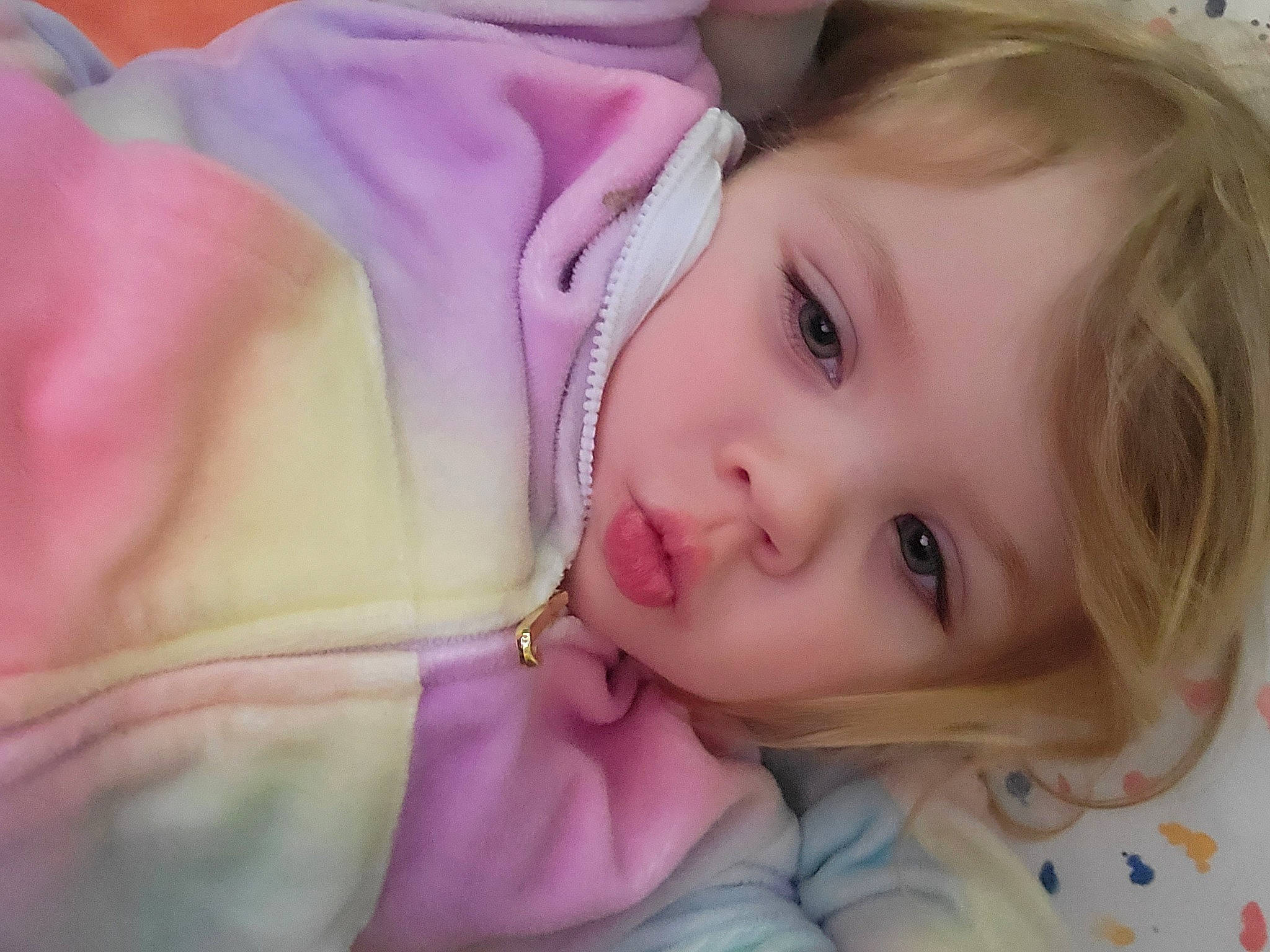 Reya is registered to the contest to win money with this photo: baby_toddler_clothing, brown_hair, cheek, child, close_up, eye, eyebrow, eyelash, fashion_accessory, fun, happy, iris, lip, neck, nose, person, pink, purple, skin, smile