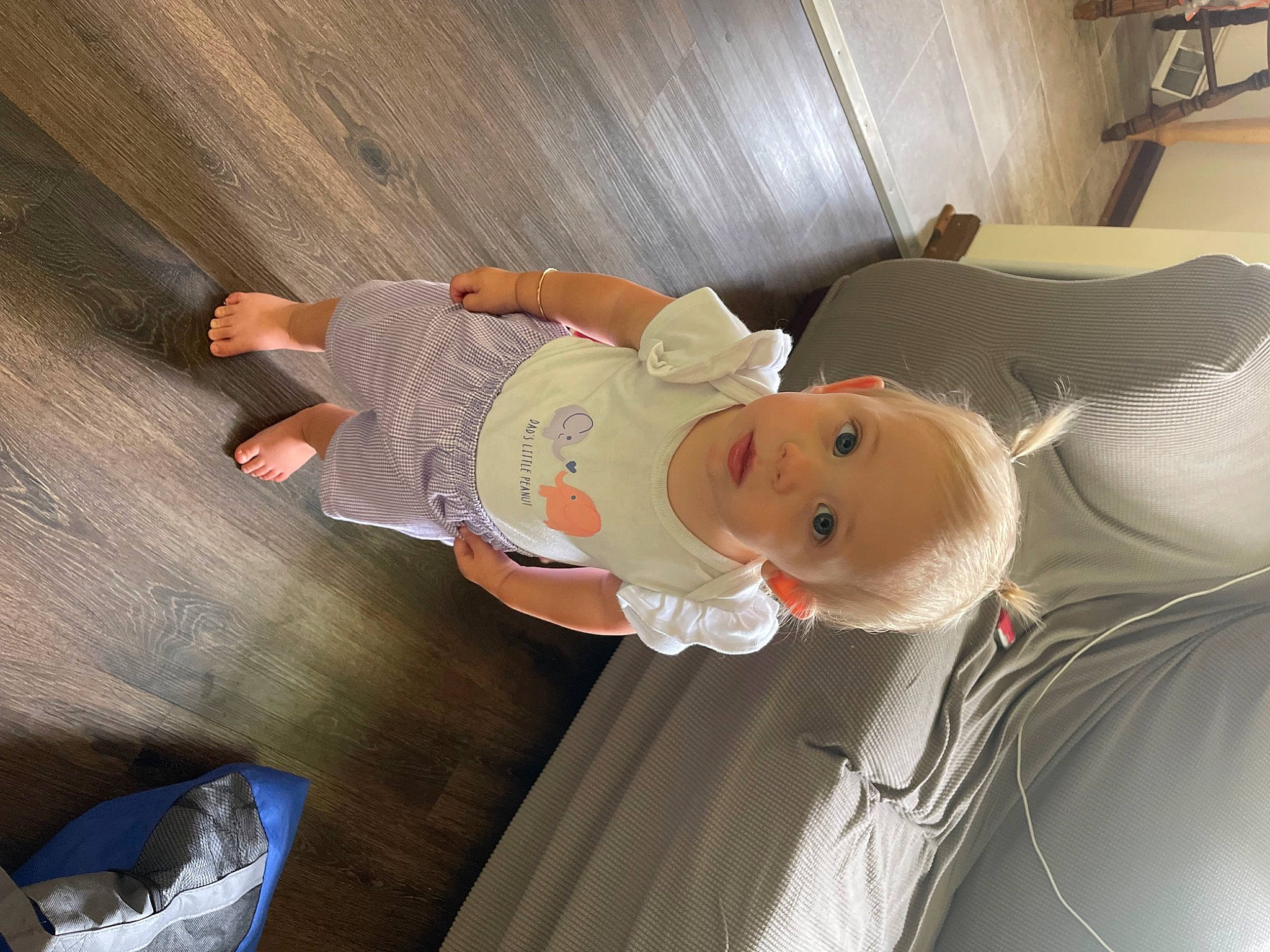 Heidi is registered to the contest to win money with this photo: automotive_exterior, automotive_lighting, baby, ceiling, child, comfort, flooring, fun, happy, hardwood, hat, person, room, smile, toddler, vehicle, vehicle_door, wood