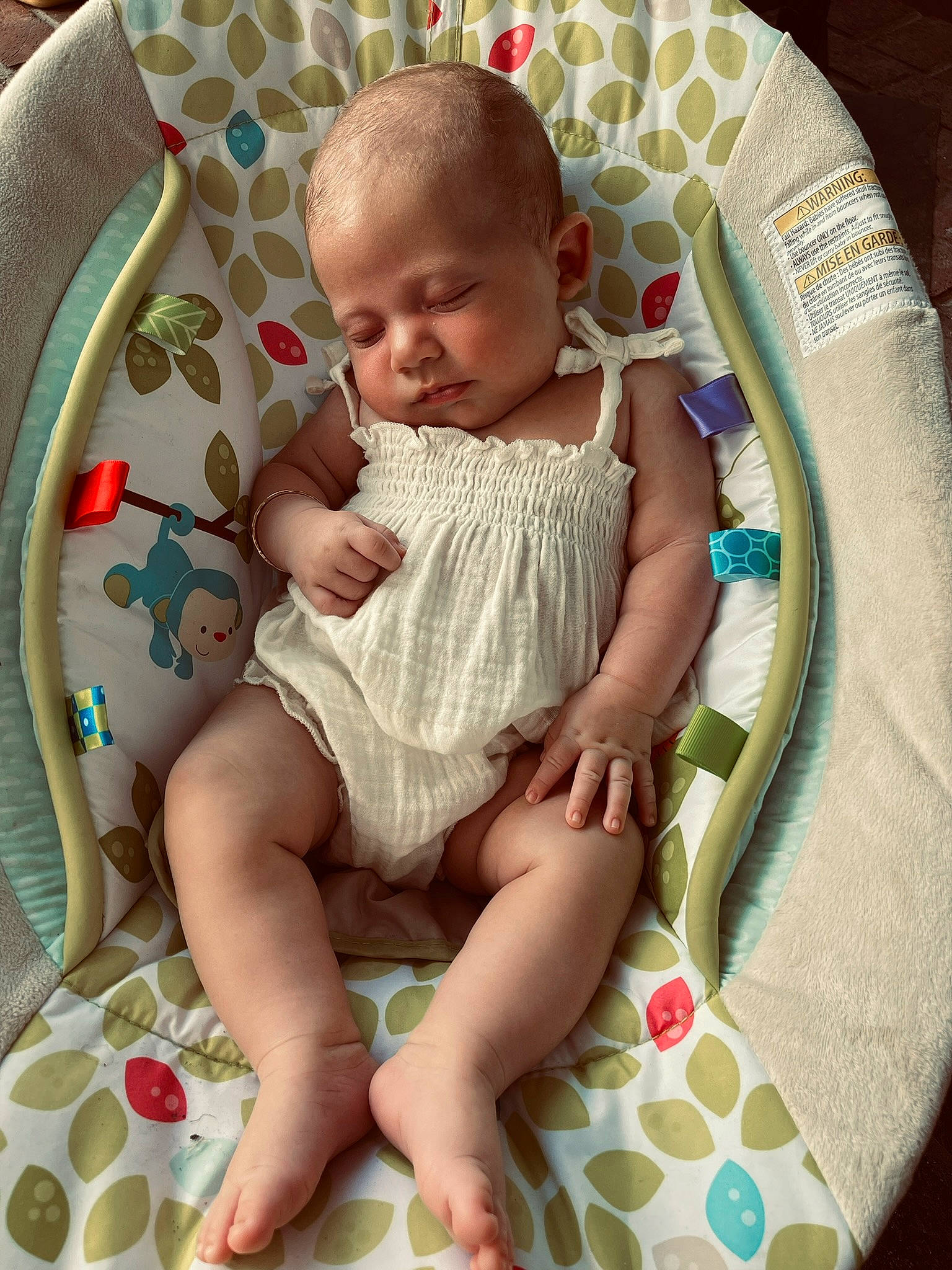 Heidi Brooke Turner is registered to the contest to win money with this photo: baby, baby_products, baby_toddler_clothing, chair, cheek, chest, child, comfort, finger, foot, happy, human_leg, lap, leg, pattern, person, sitting, skin, sock, thigh