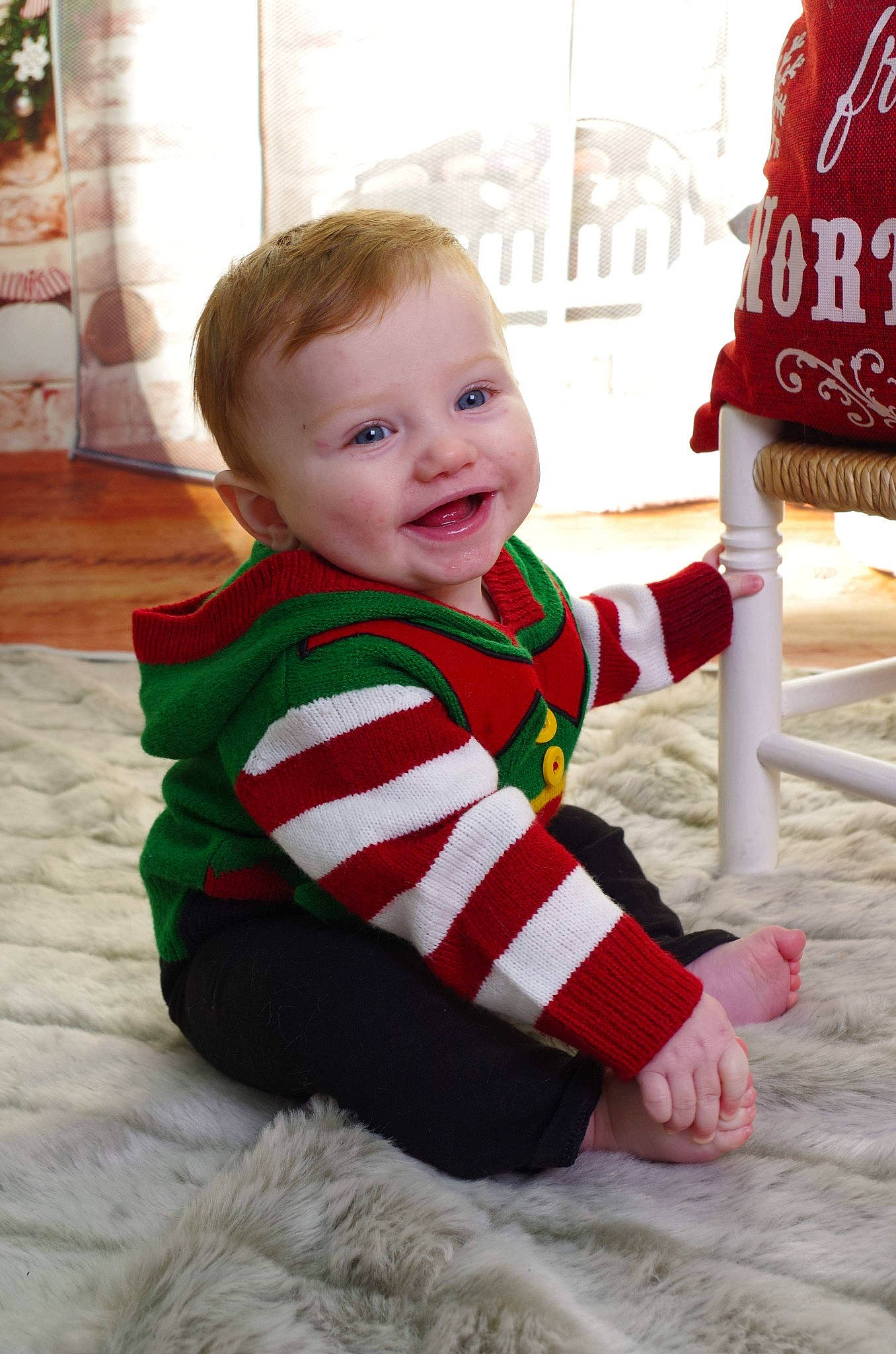 Clay is registered to the contest to win money with this photo: boy, child, christmas, day, fun, girl, holiday, infant, outerwear, pattern, person, product, red, sitting, skin, smile, standing, textile, toddler