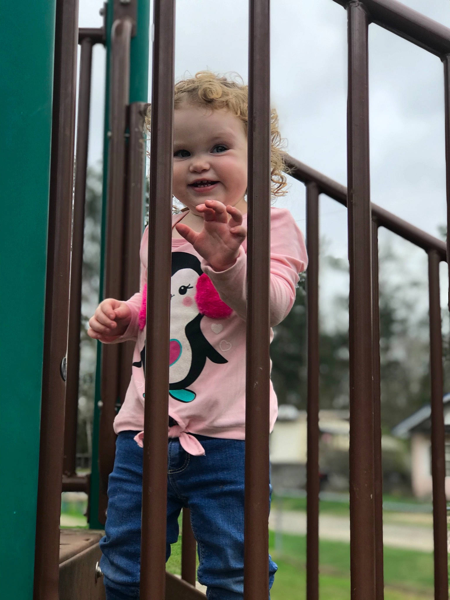 Alora is registered to the contest to win money with this photo: child, city, human_settlement, joy, outdoor_play_equipment, person, play, playground, public_space, recreation, toddler, window