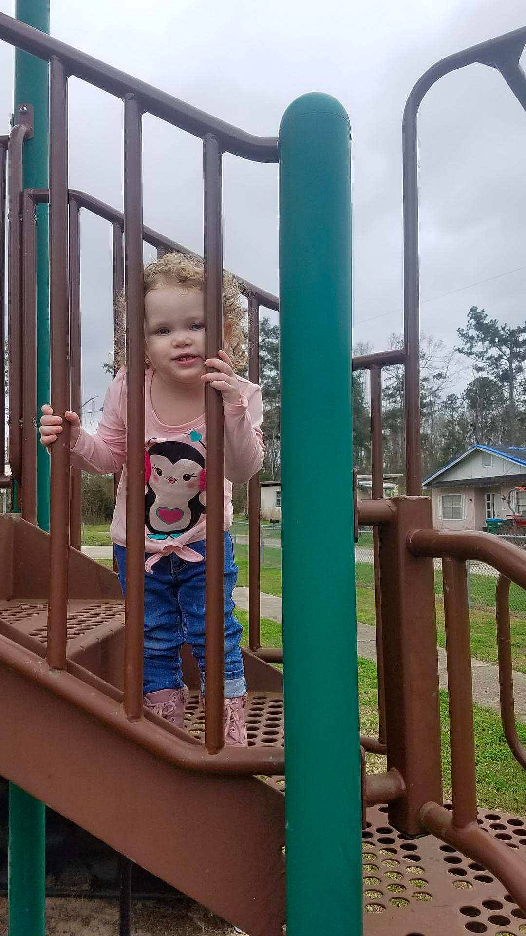 Alora is registered to the contest to win money with this photo: city, human_settlement, leisure, outdoor_play_equipment, person, play, playground, playground_slide, public_space, recreation, toddler