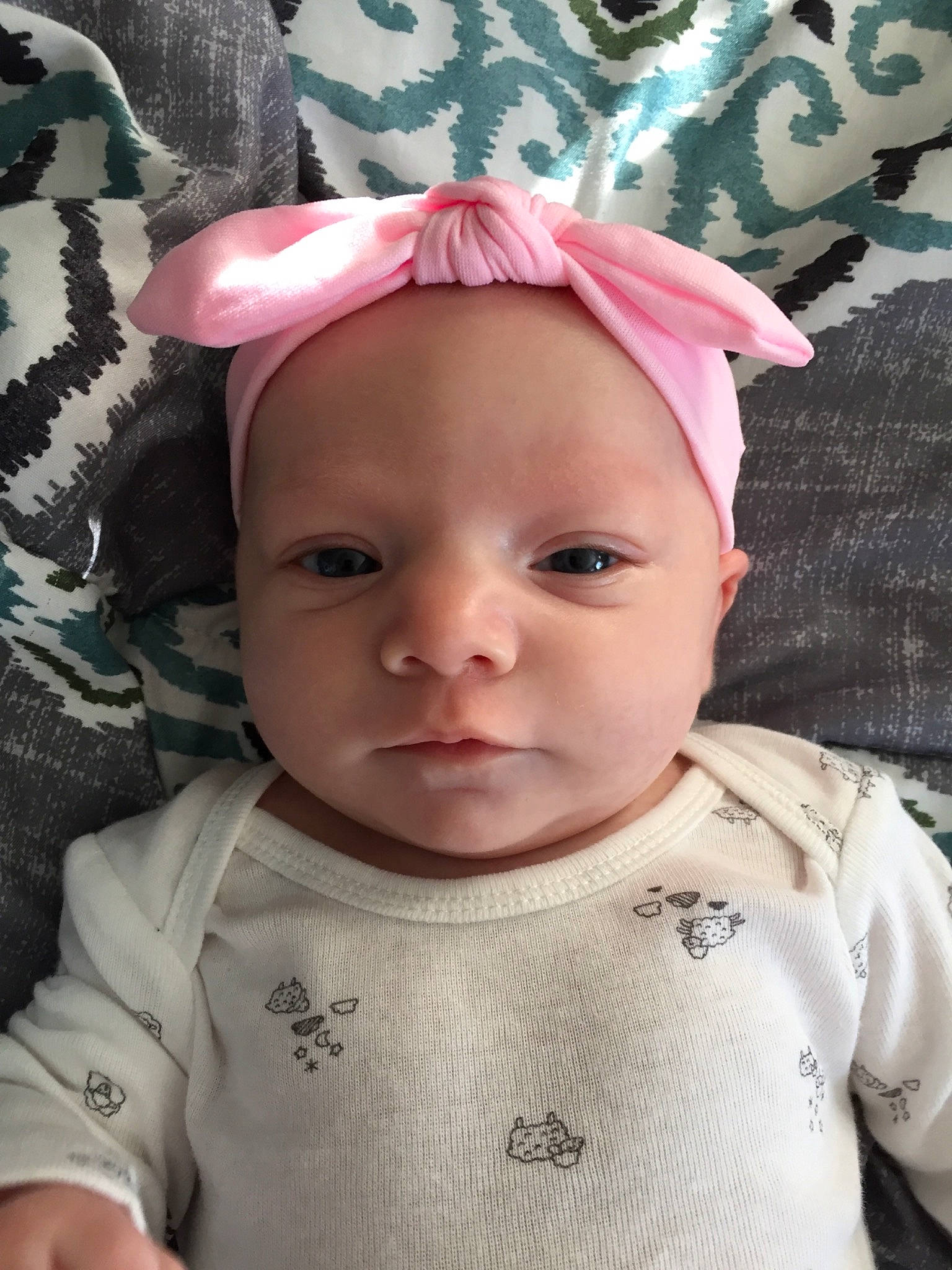 Natalia is registered to the contest to win money with this photo: baby, baby_toddler_clothing, cheek, child, ear, face, hair_accessory, head, headgear, headwear, person, pink, skin, toddler