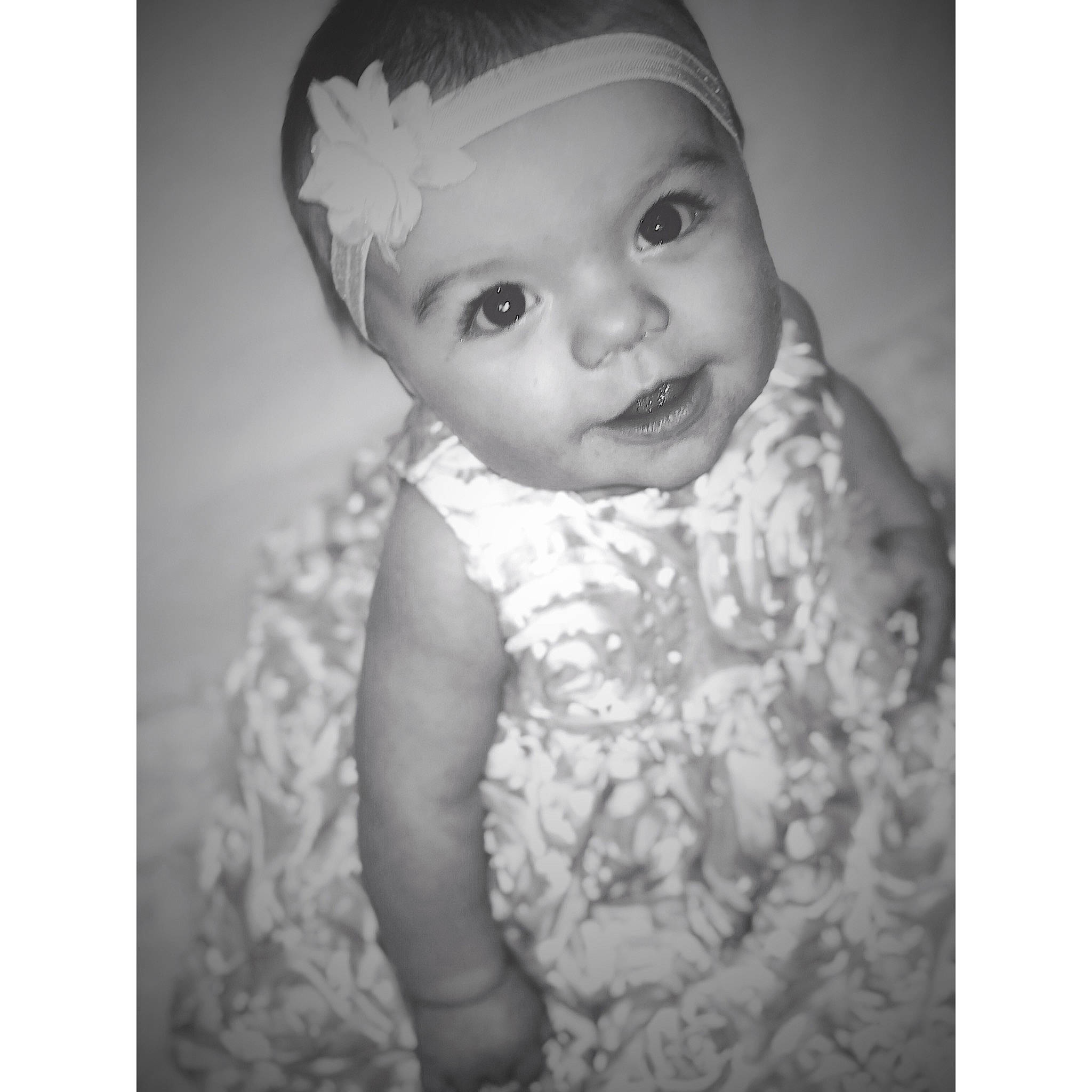 Brenleigh is registered to the contest to win money with this photo: baby, black_and_white, bonnet, child, child_model, dress, hair_accessory, head, headgear, headpiece, monochrome, monochrome_photography, person, photograph, photography, portrait, smile, snapshot, stock_photography, toddler