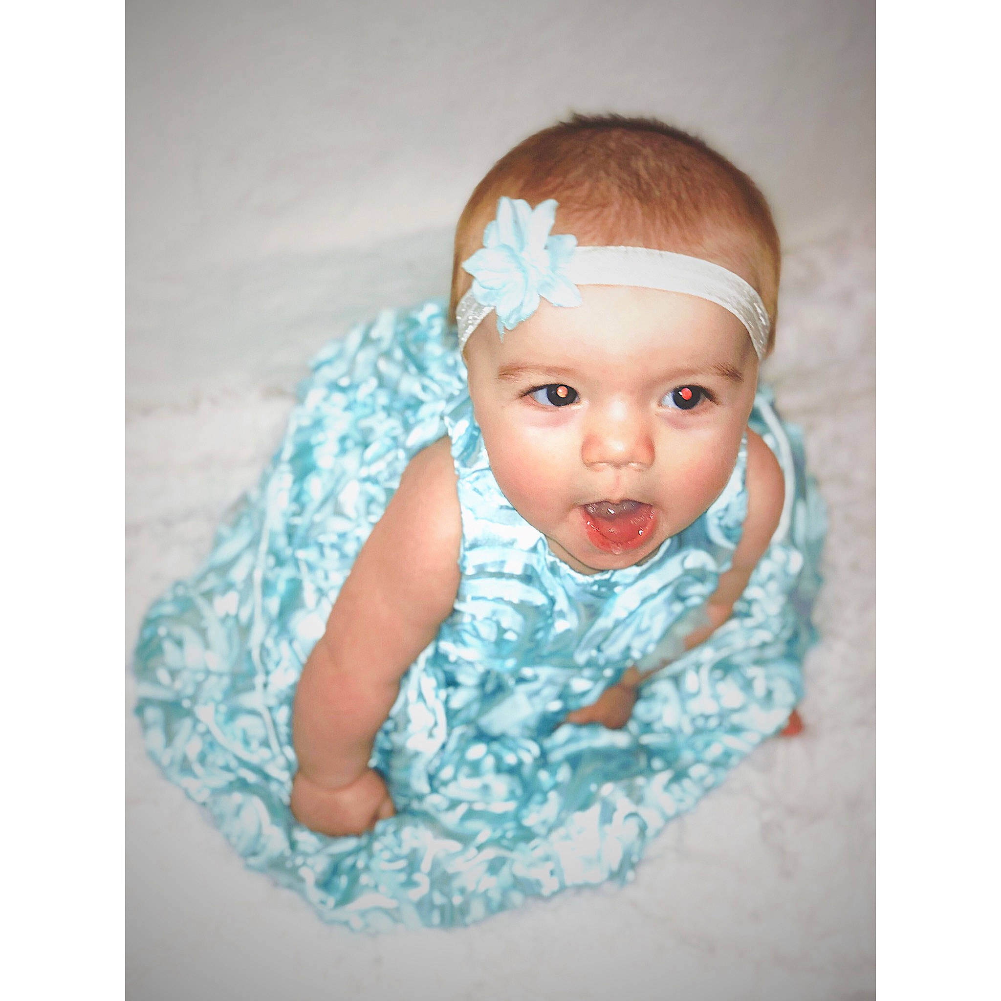 Brenleigh is registered to the contest to win money with this photo: aqua, baby, cheek, child, eye, eyebrow, face, fashion_accessory, forehead, hair_accessory, head, headband, headgear, headpiece, iris, person, skin, stock_photography, toddler, turquoise
