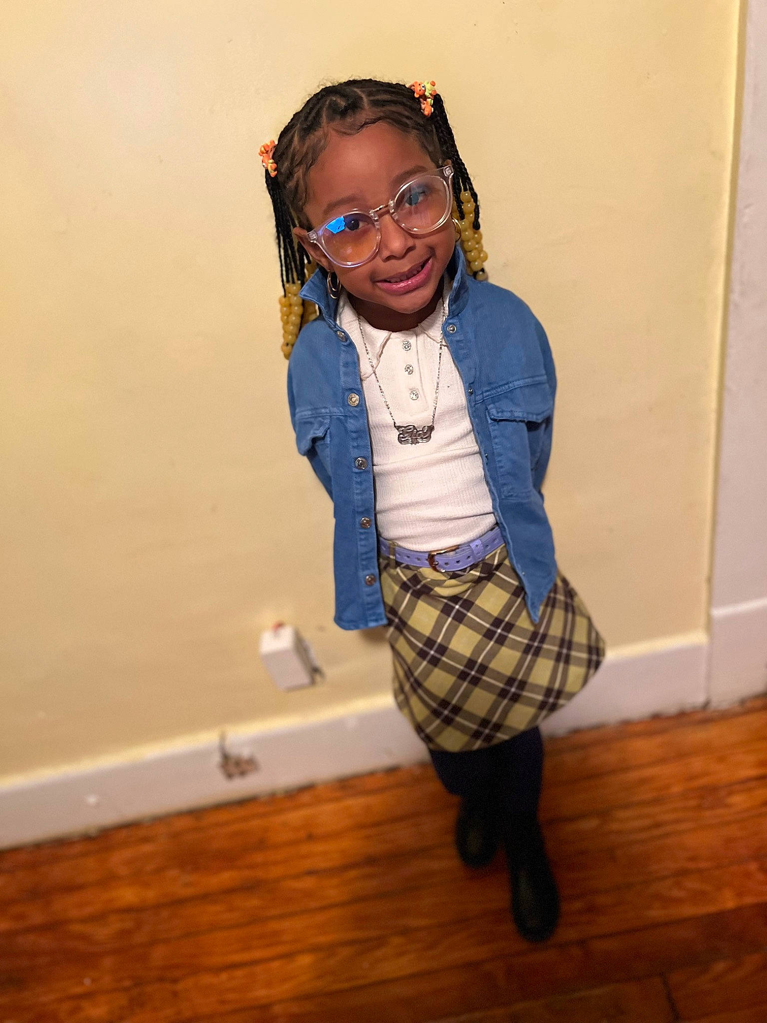 Gia joined the competition — help win amazing prizes! electric_blue, eyewear, face, fashion_design, flooring, glasses, happy, hardwood, head, joy, knee, pattern, person, personal_protective_equipment, plaid, room, sleeve, smile, tartan, vision_care