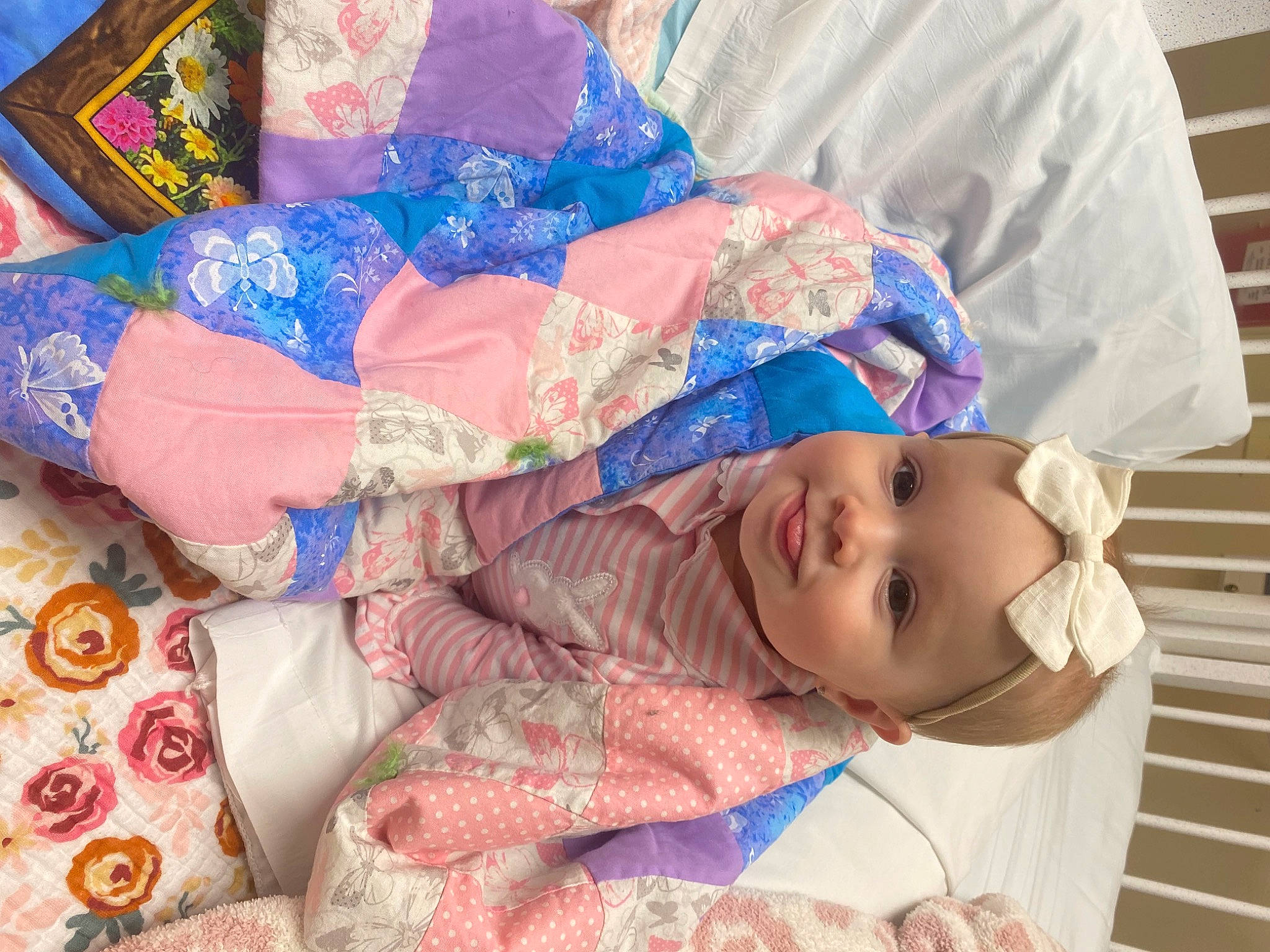 Parker Collins is registered to the contest to win money with this photo: baby, baby_products, baby_toddler_clothing, child, comfort, happy, hat, headwear, linens, magenta, pattern, peach, person, pink, room, sleeve, smile, sunglasses, textile, toddler