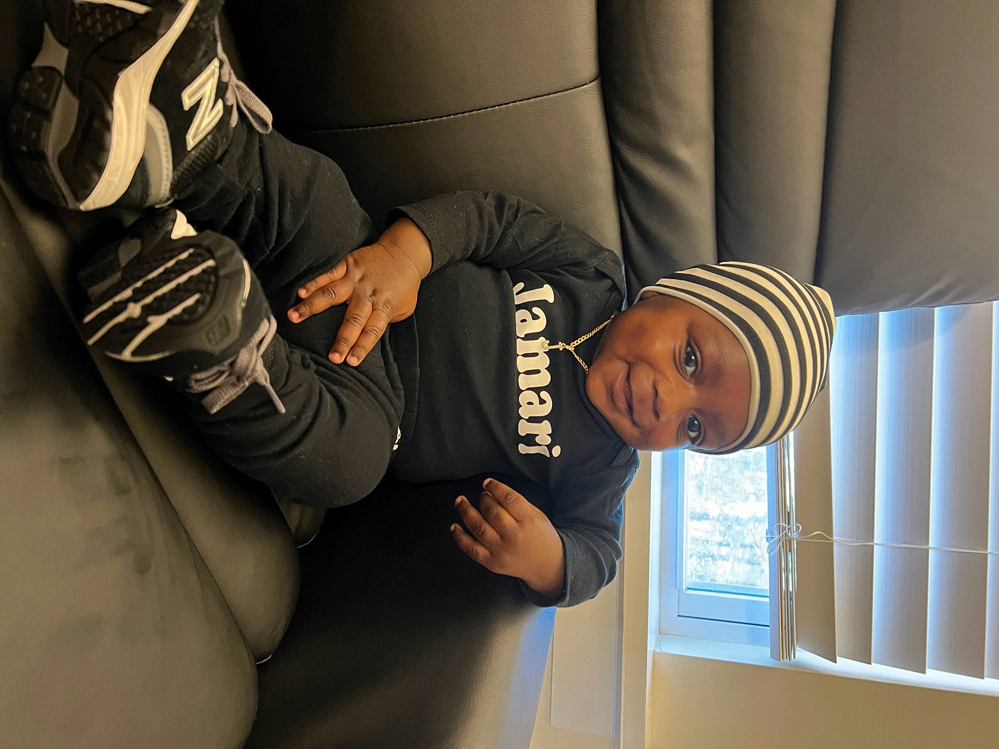 Jamari joined the competition — help win amazing prizes! baseball_cap, cap, comfort, elbow, eyewear, fashion, flash_photography, font, gesture, glasses, hat, headgear, headwear, joy, person, room, shoulder, sitting, sleeve, sportswear