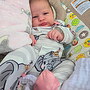 Skylar joined the competition — help win amazing prizes! baby, infant, child, pajamas, elephant_print, pink_booties, blanket, baby_seat, colorful, patterned, cute, comfort, indoor, soft_toys, face, looking, relaxed, small_hands, footwear, clothing