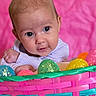 Skylar joined the competition — help win amazing prizes! baby, infant, easter_basket, colorful, sparkling_eggs, pink_background, cute, portrait, child, smiling, curious, closeup, face, hands, woven_basket, holiday, festive, bright, happy, indoors